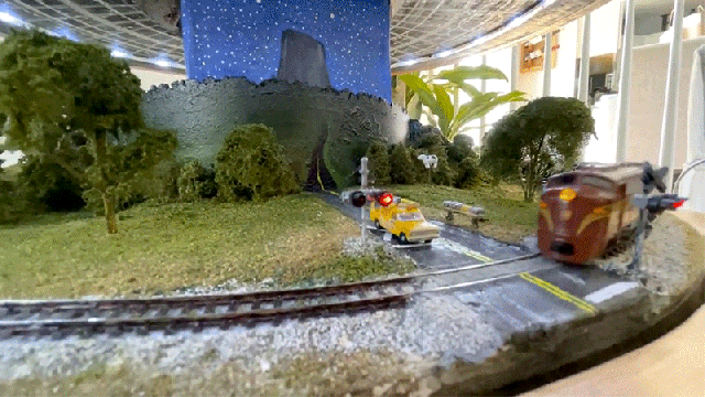 Unassuming Side Table Transforms to Reveal a Close Encounters-Themed Model Railroad Inside