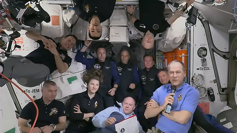 Eleven astronauts now occupy the ISS. The four Axiom crew members are standing (floating?) upright at the back.  (Image: NASA)