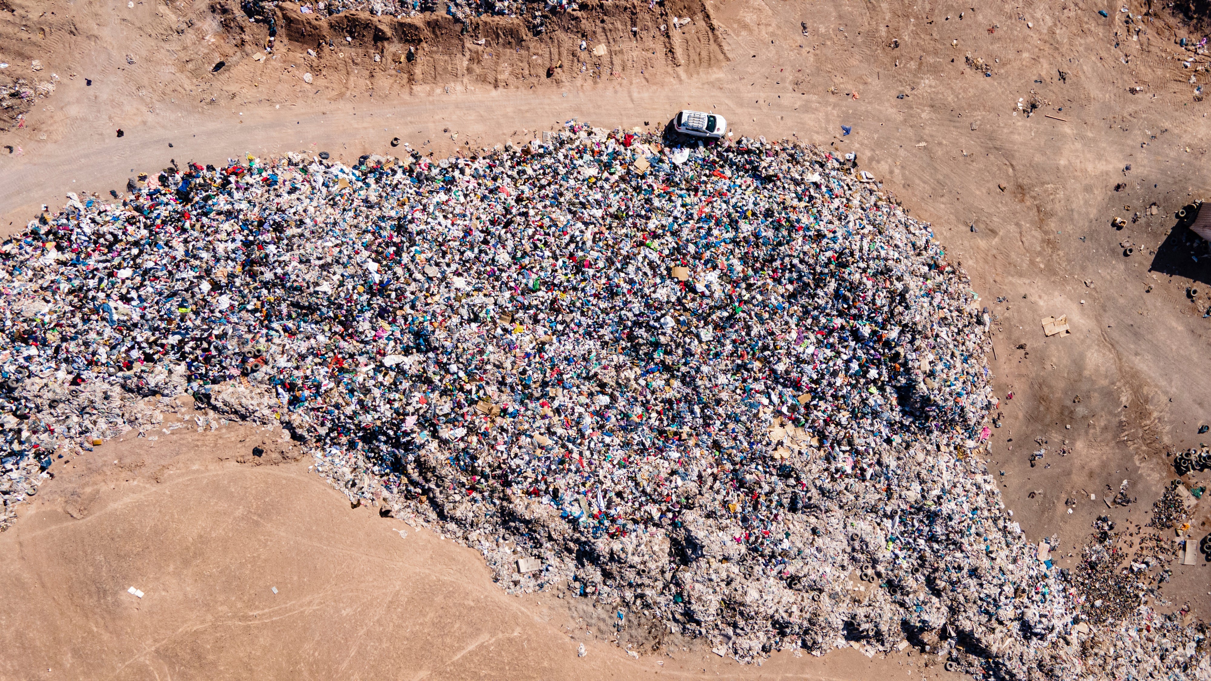 An aerial view of piles of used clothing. (Photo: Antonio Cossio, AP)