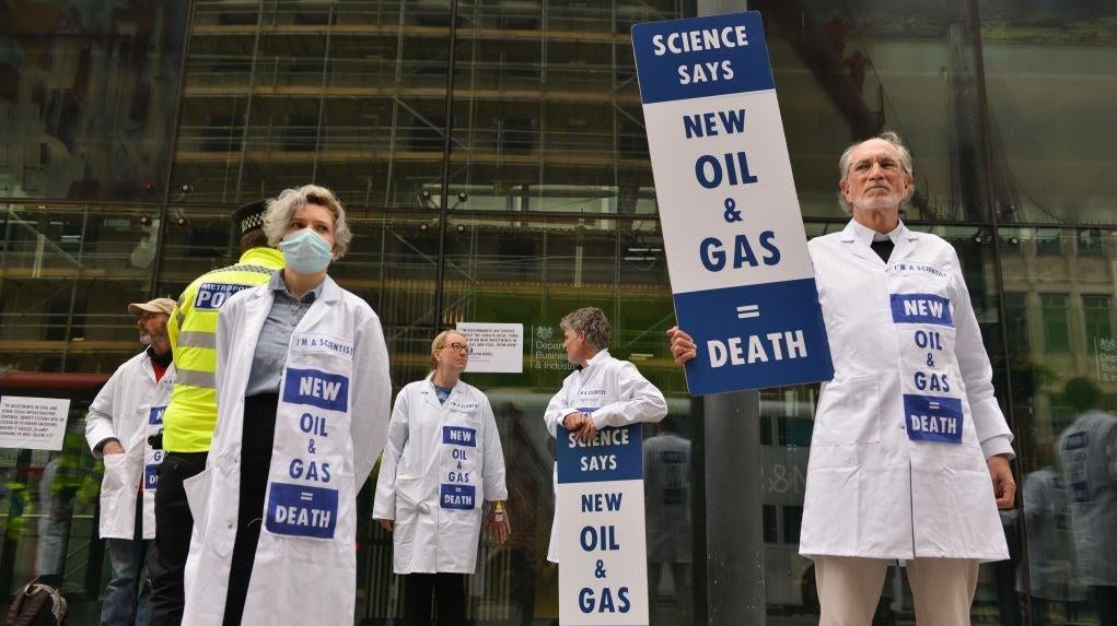 Activists hold signs calling for no new fossil fuel projects outside the UK Department for Business, Energy and Industrial Strategy during a protest on April 13, 2022 (Photo: Thomas Krych/SOPA Images/LightRocket, Getty Images)
