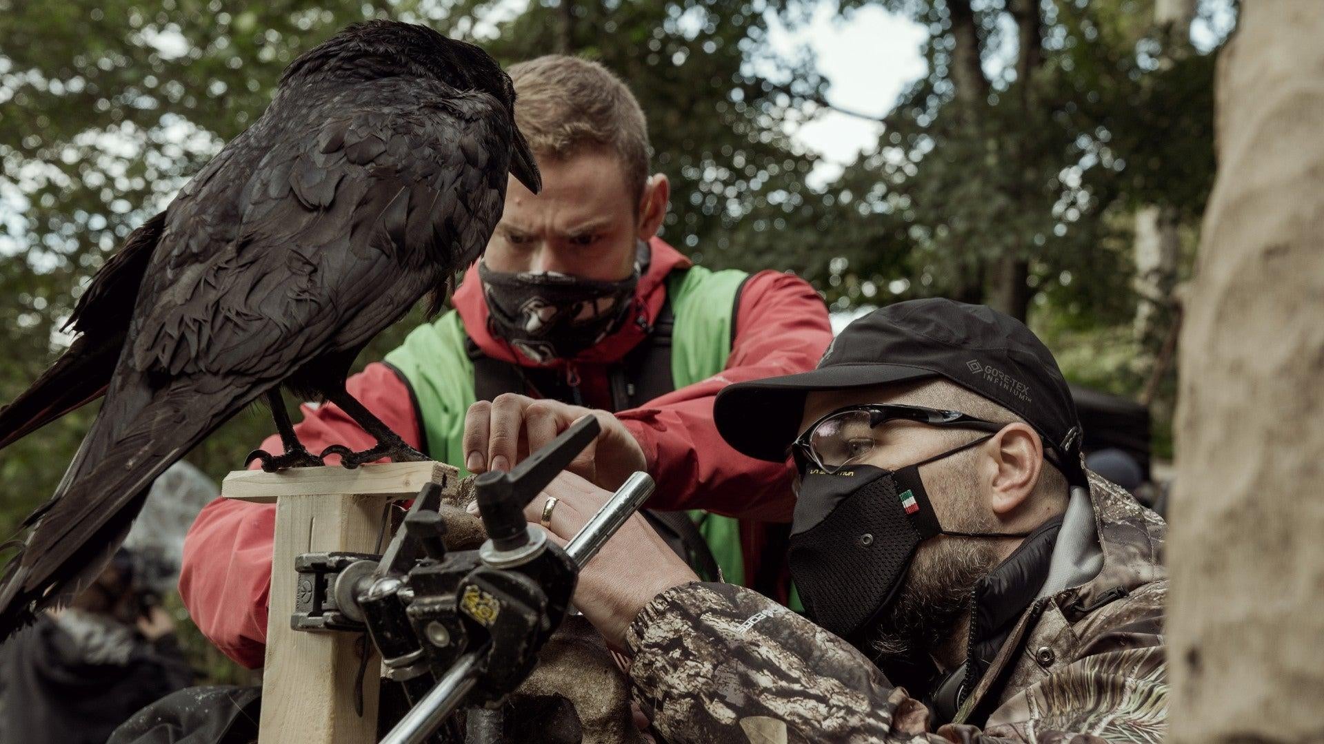 A masked Eggers working with a real bird. (Image: Focus Features)
