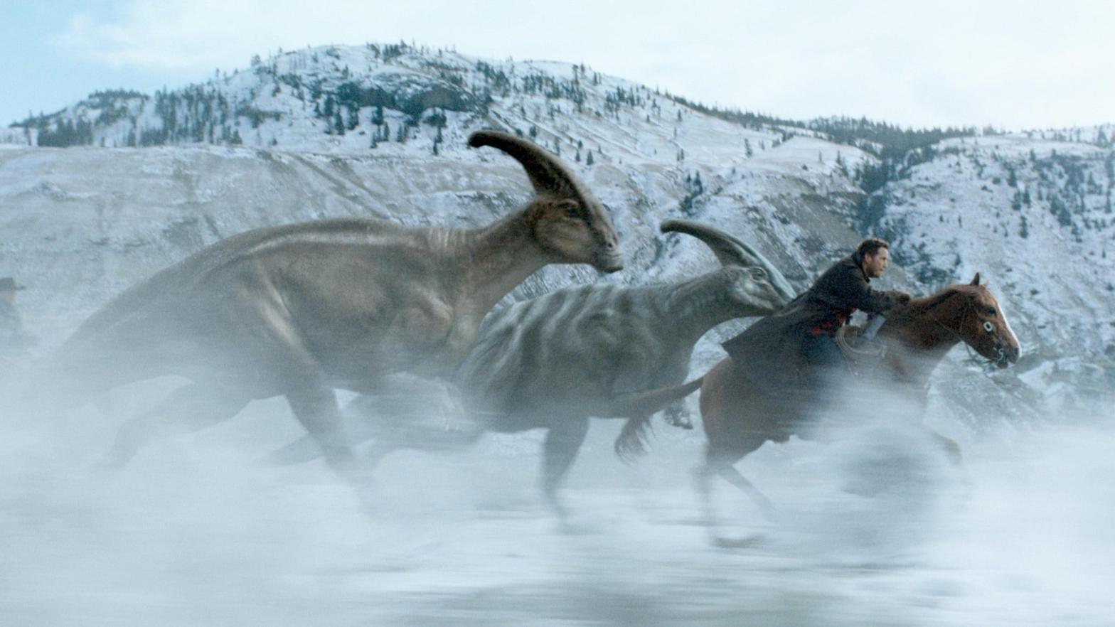 Chris Pratt making like Ginuwine and riding that pony. Only it's a horse. With dinosaurs.  (Image: Universal)