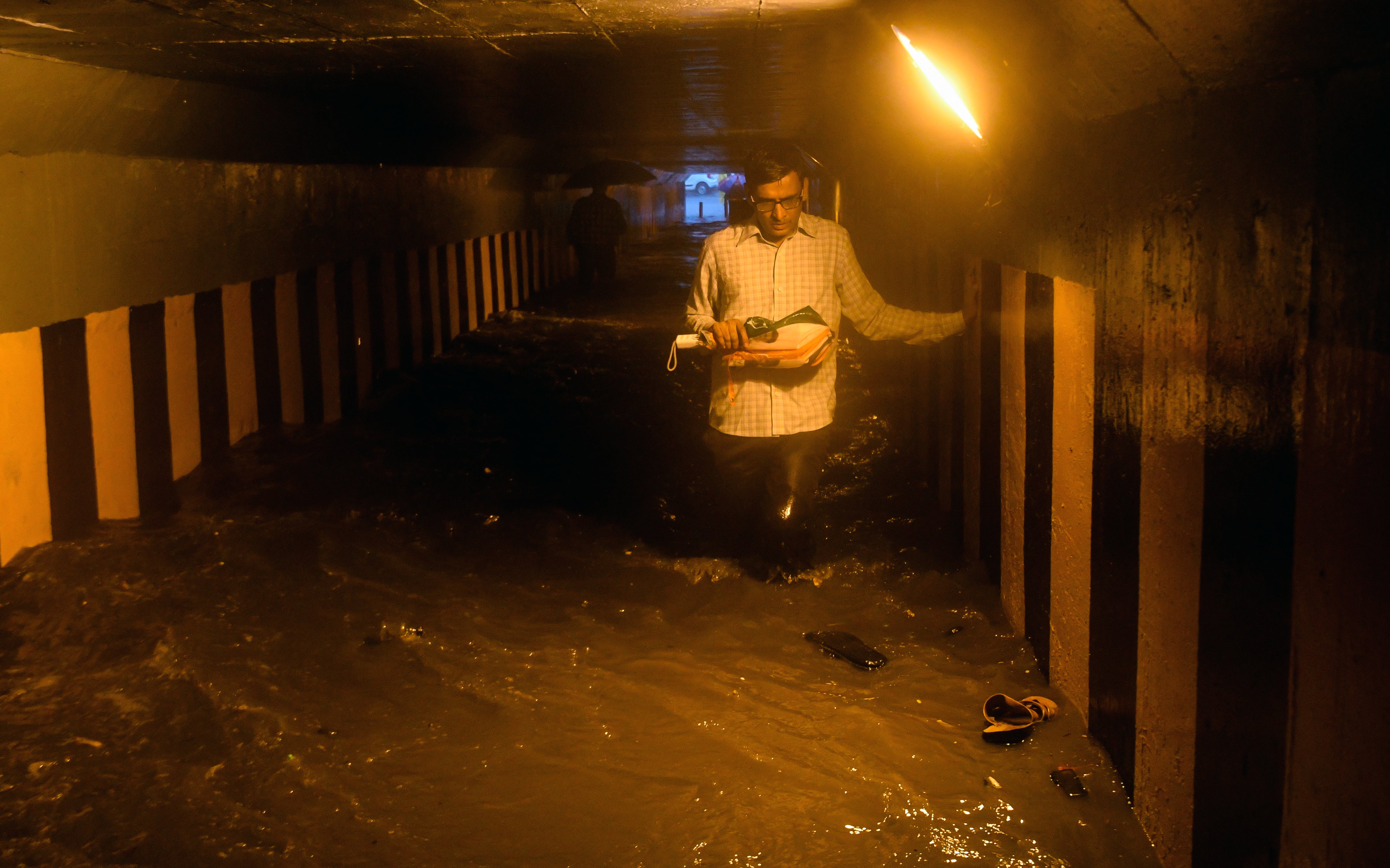 A man walks through a waterlogged subway, at Andheri, on June 28, 2019 in Mumbai, India.  (Photo: Shashi S Kashyap/Hindustan Times, Getty Images)