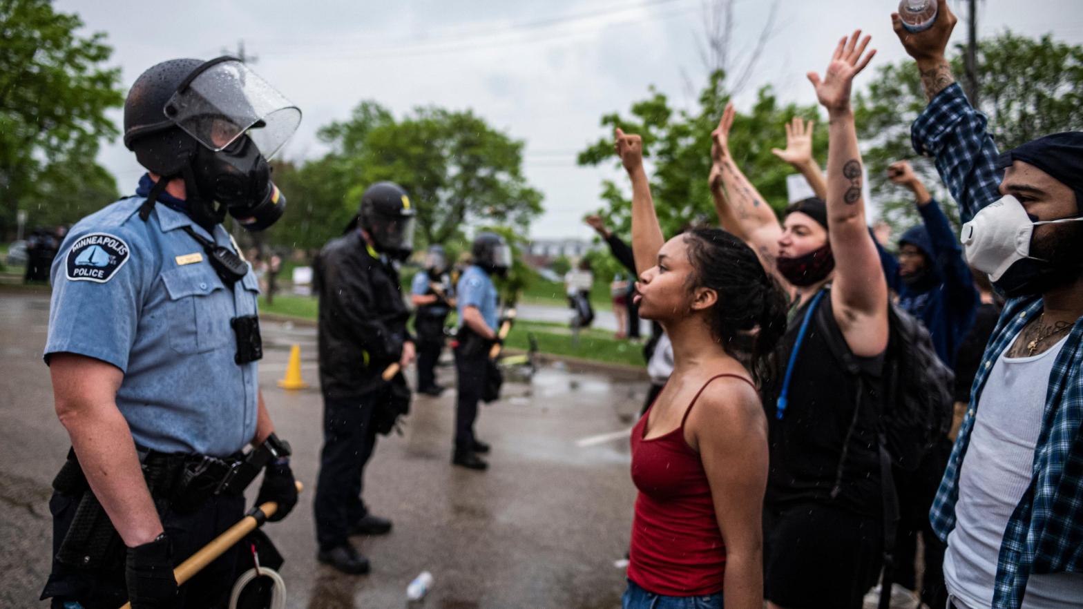 Protesters and police face each other during a rally for George Floyd in Minneapolis on May 26, 2020. (Photo: Richard Tsong-Taatarii, AP)