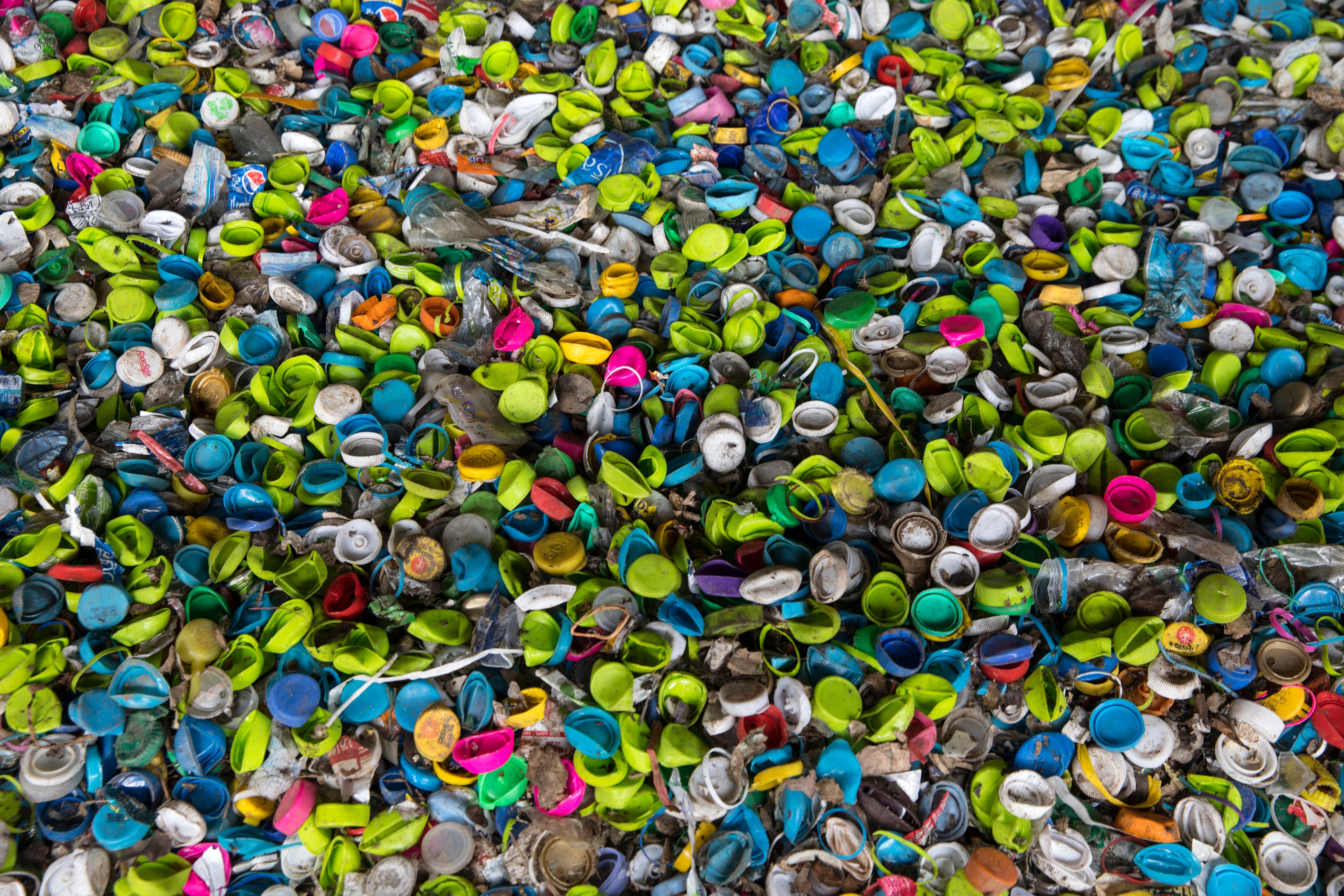 Plastic bottle caps made from HDPE in a recycling processing facility in Nakon Pathom, Thailand. (Photo: Paula Bronstein, Getty Images)