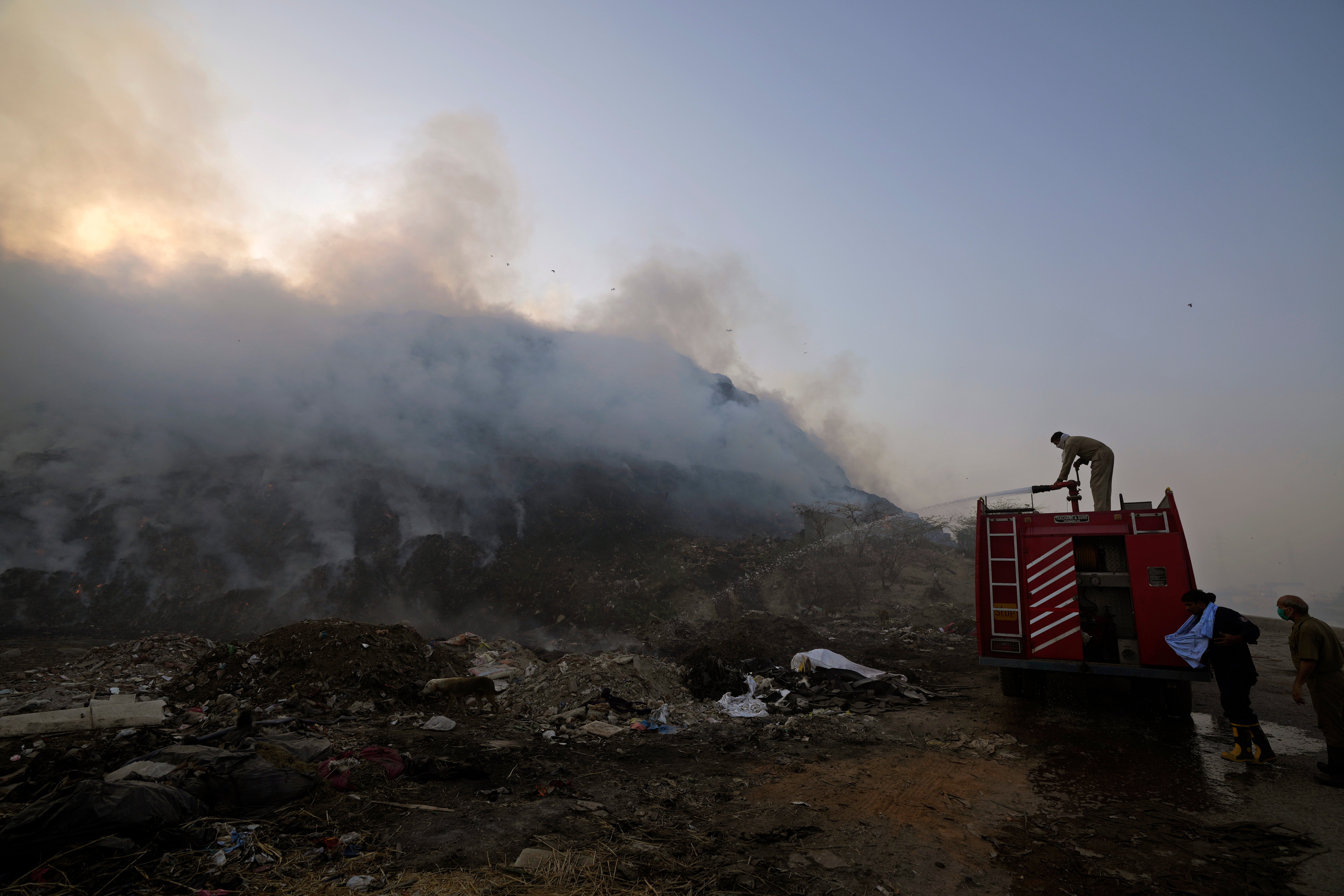 Firefighters attempt to put out the blaze on April 27. (Photo: Manish Swarup, AP)