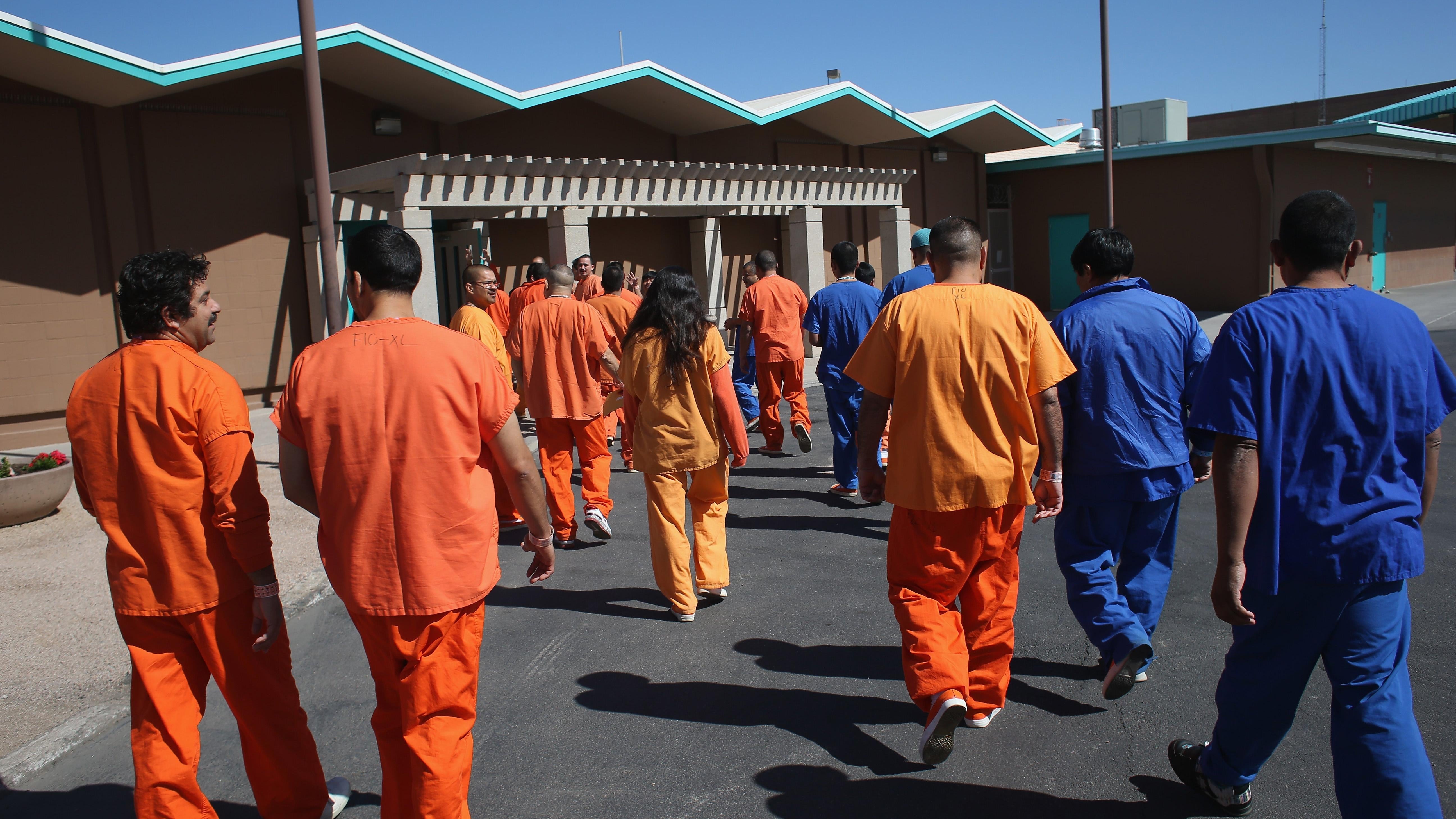  Immigrant detainees walk through the Immigration and Customs Enforcement (ICE), detention facility on February 28, 2013 in Florence, Arizon (Photo: John Moore, Getty Images)