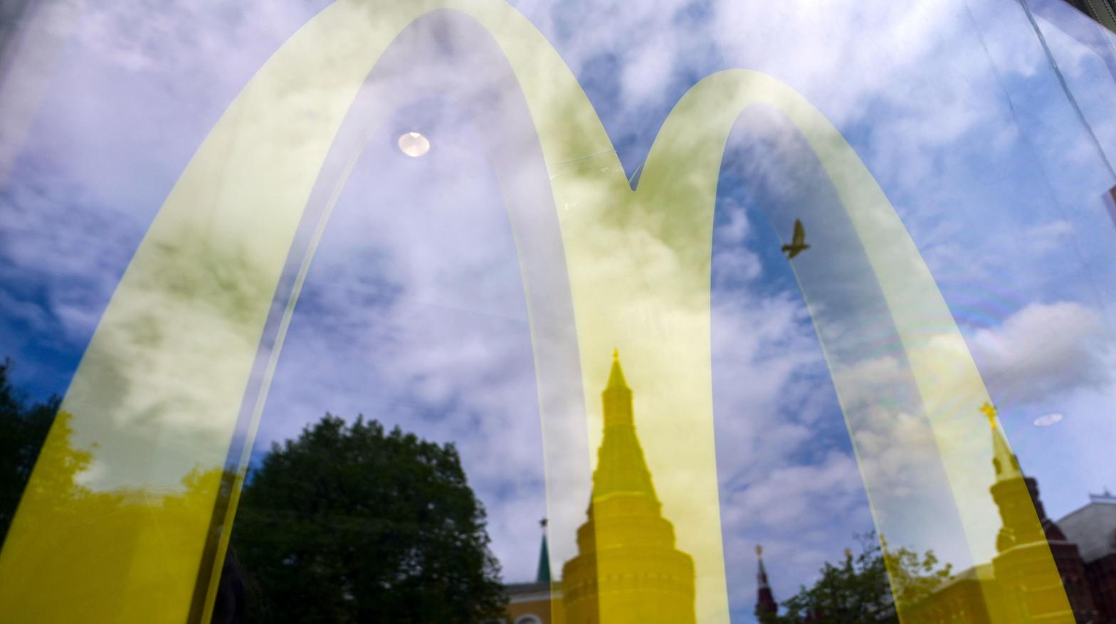 The Kremlin's towers are seen reflected in the window of a closed McDonald's restaurant in Moscow on May 16, 2022. (Photo: Natalia Kolesnikova / AFP, Getty Images)