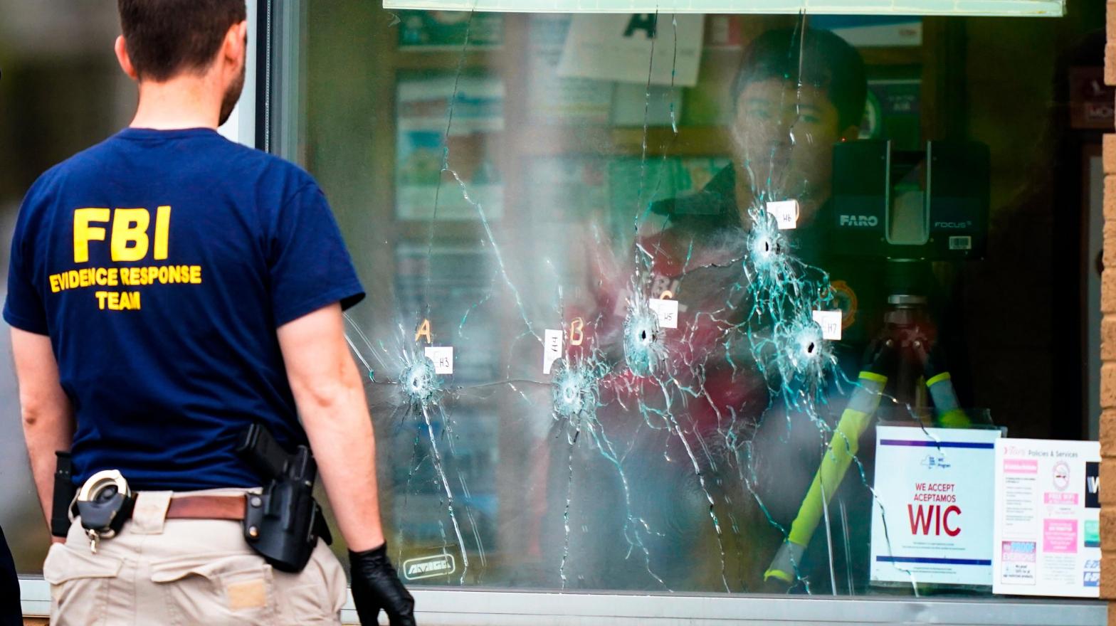 Investigators work at the scene of a terrorist shooting at a supermarket in Buffalo, New York on May 16, 2022. (Photo: Matt Rourke, AP)