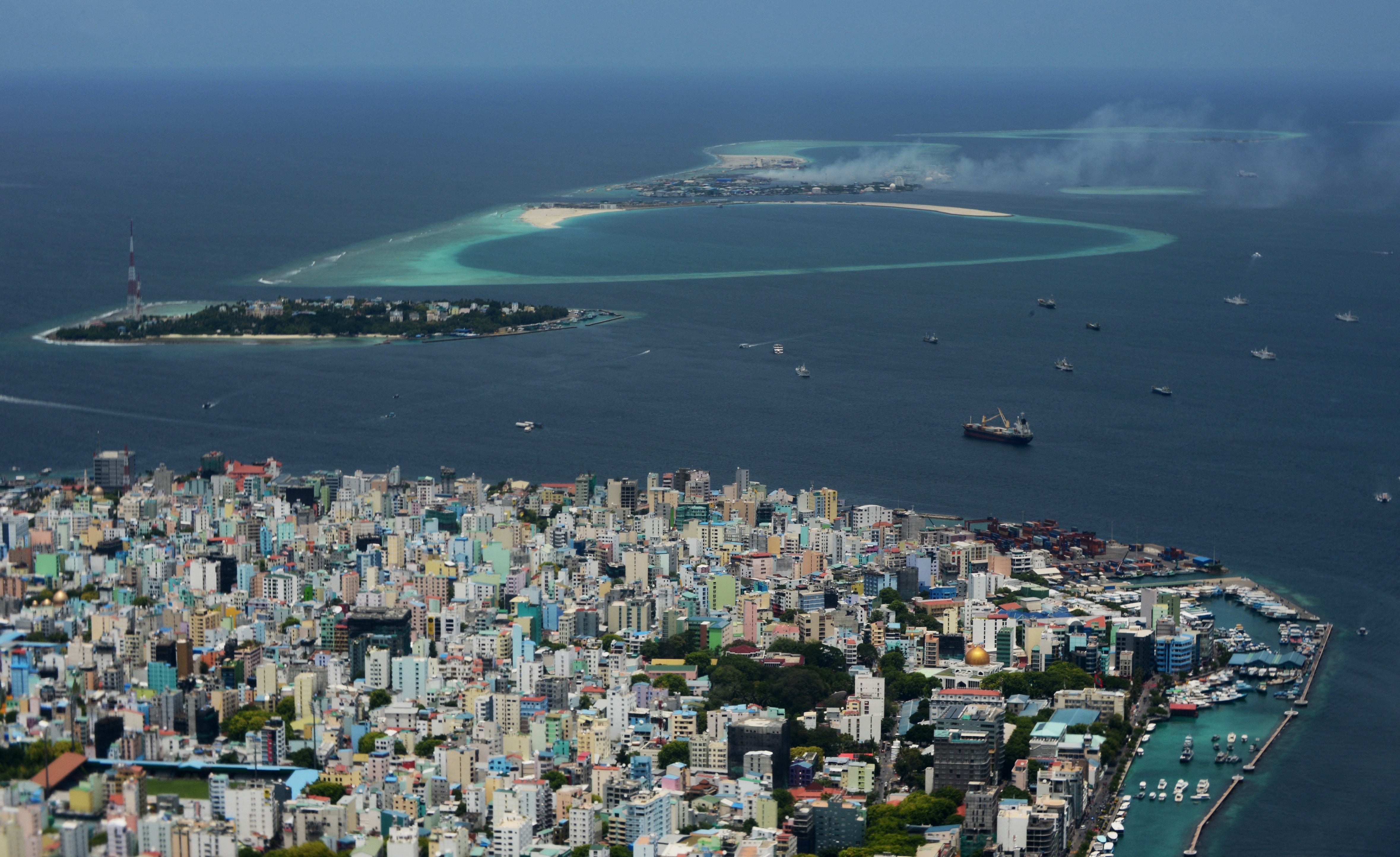 In this 2013 photo, smoke from Thilafushi can be seen near the capital city of Male. (Photo: Roberto SCHMIDT / AFP, Getty Images)