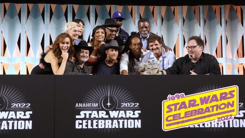 The cast and crews of The Mandalorian, and Ahsoka, sit with Grogu at Celebration. (Image: Disney)