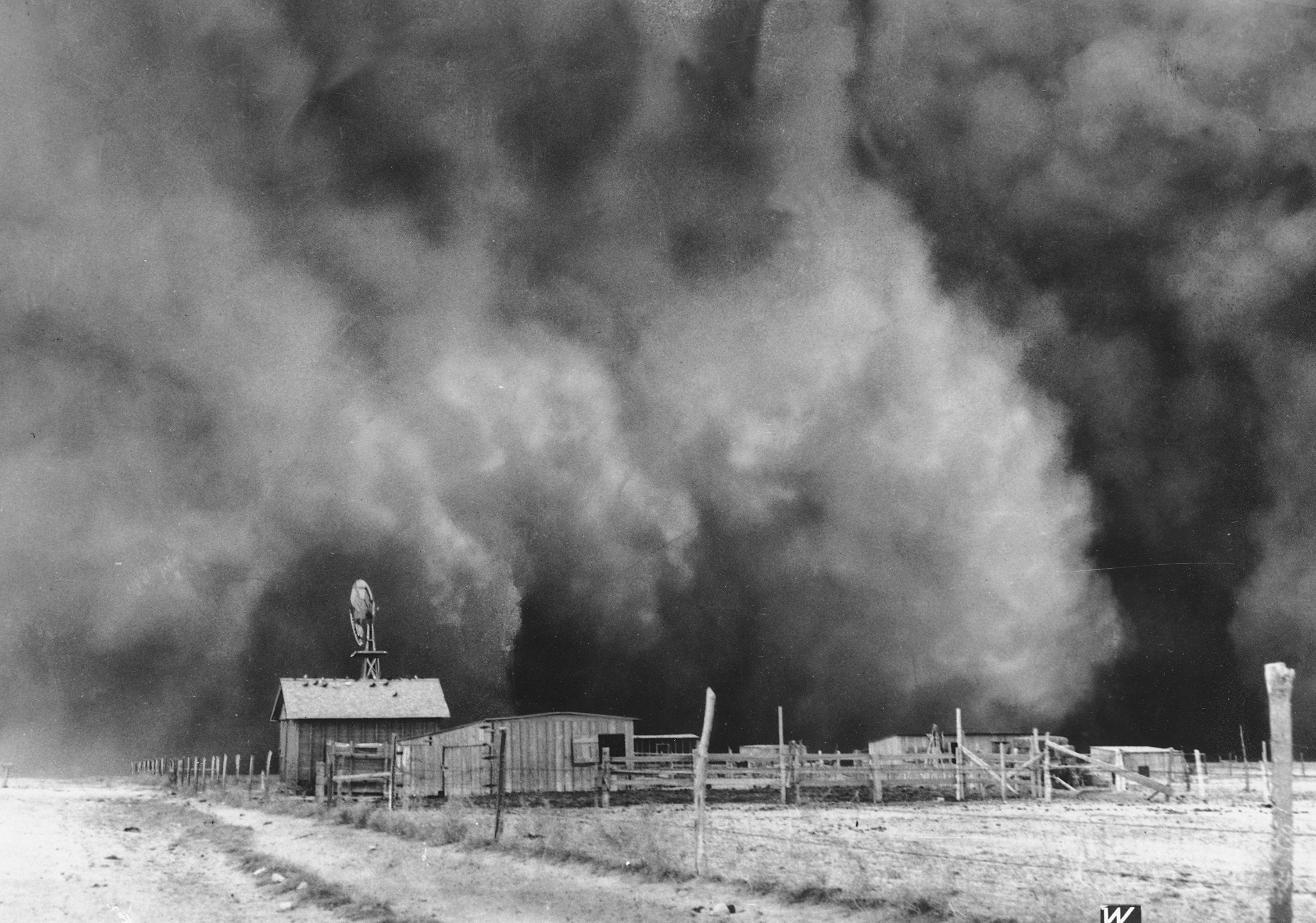 A dust cloud approaches a ranch in Boise City, Oklahoma in 1935.   (Photo: AP Photo, AP)