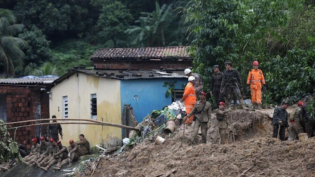 Rescue teams work at the scene of a landslide in Recife, Pernambuco State, in Brazil on May 30 after heavy rain.  (Photo: SERGIO MARANHAO/AFP, Getty Images)