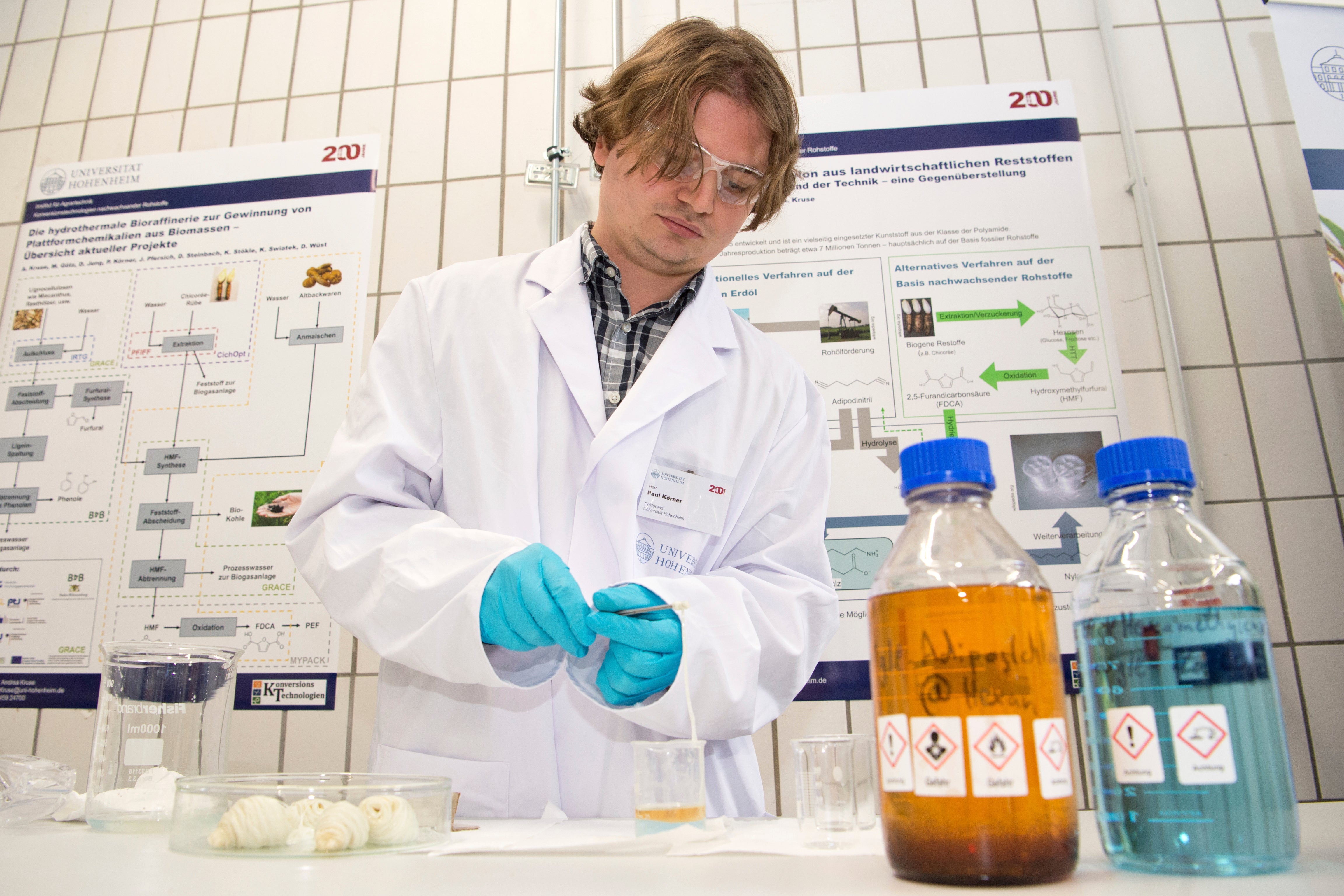 A scientist at the University of Hohenheim in Germany, which has a biorefinery that makes bioplastics from plants. (Photo: Oliver Willikonsky/picture-alliance/dpa, AP)