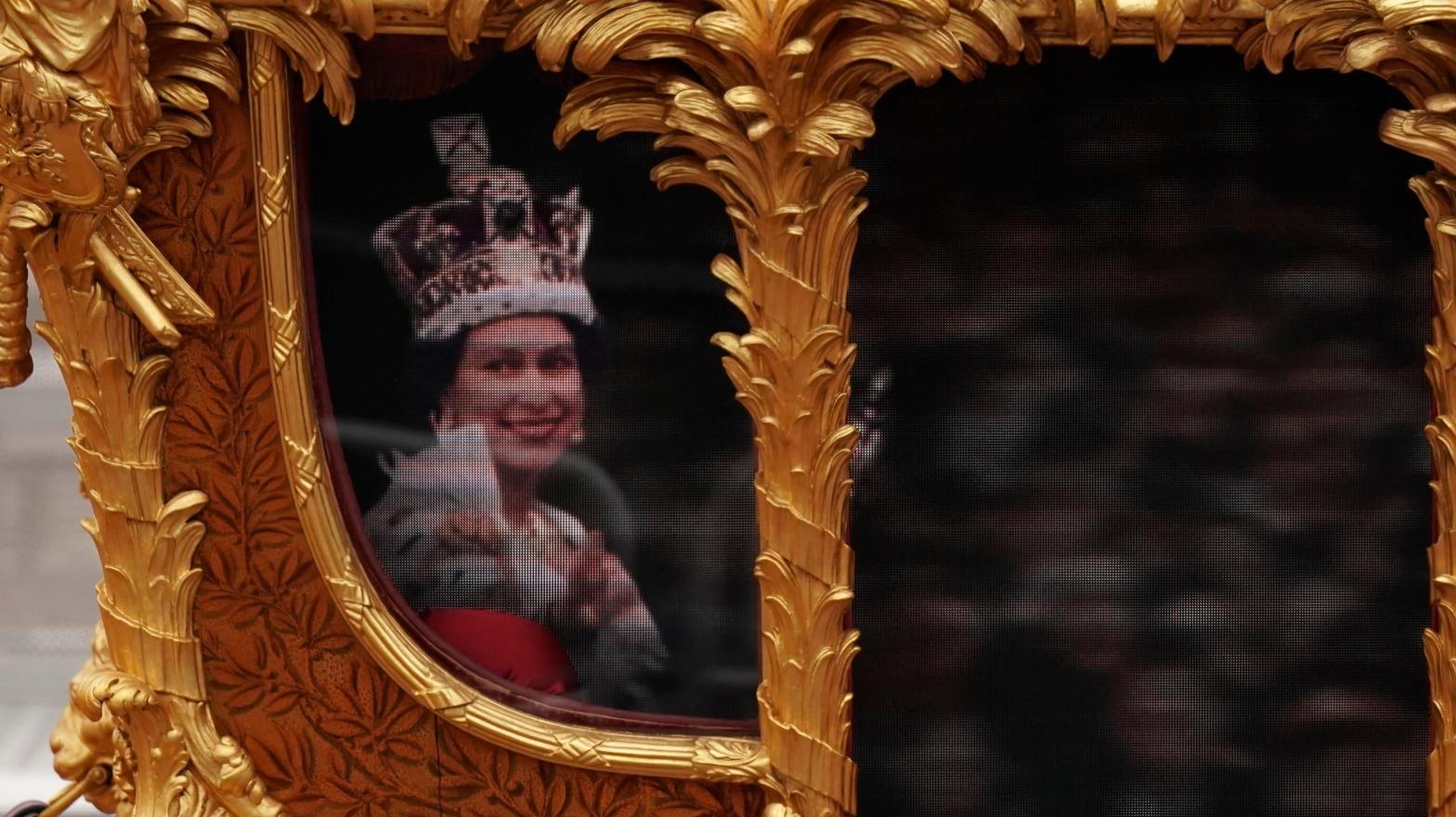 A visual display of Queen Elizabeth II during her coronation 1953 in the Gold State  Coach during the Platinum Jubilee Pageant outside Buckingham Palace in  London on June 5, 2022 (Photo: Aaron Chown, AP)