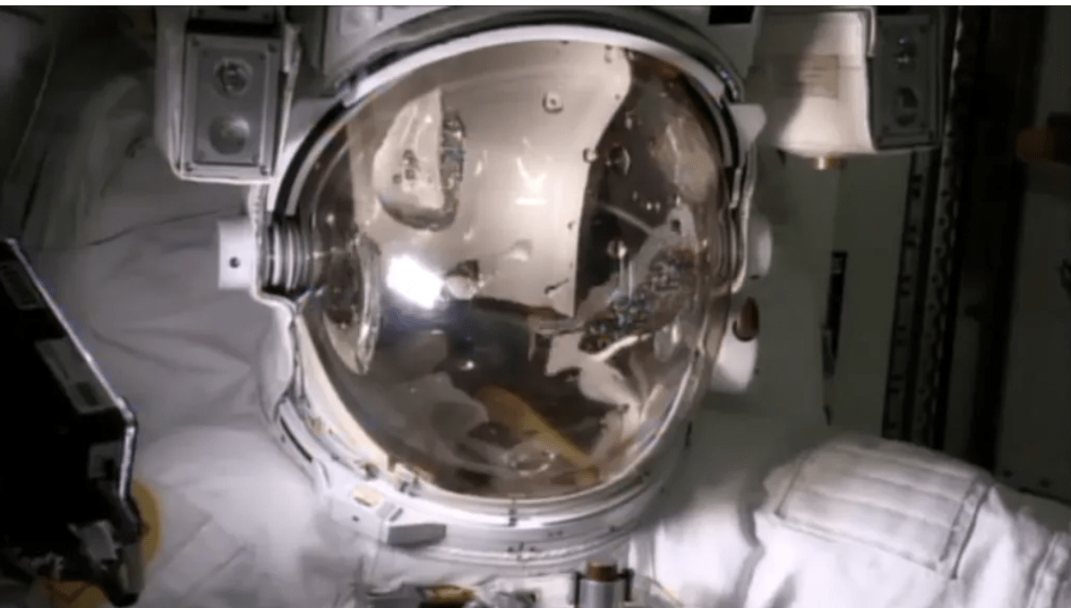 Water can be seen inside the helmet during a test of astronaut Luca Parmitano's spacesuit.  (Image: NASA TV)