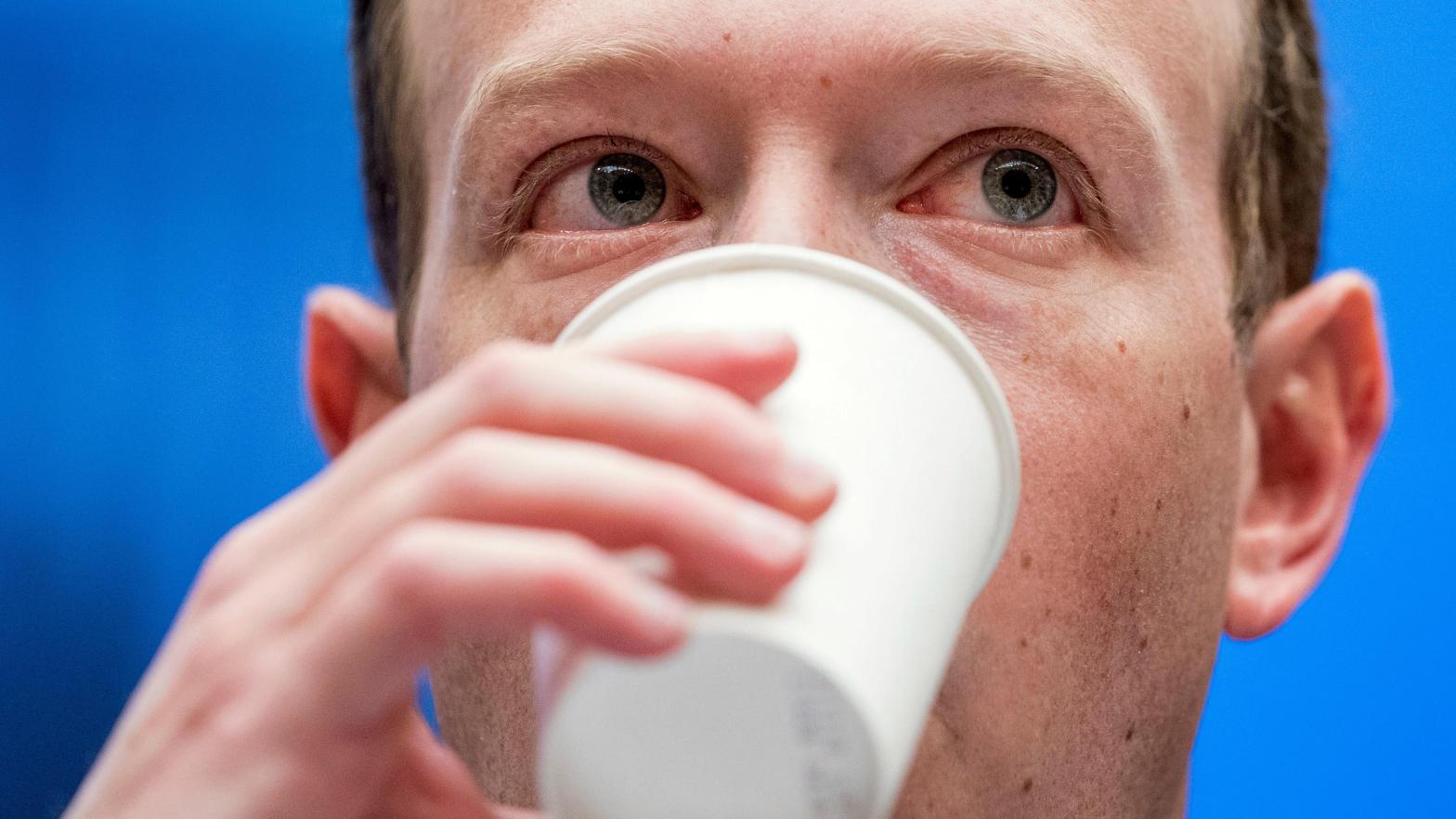Facebook CEO Mark Zuckerberg takes a drink of water as he testifies before a House Energy and Commerce hearing on Capitol Hill in Washington.  (Photo: Andrew Harnik, AP)