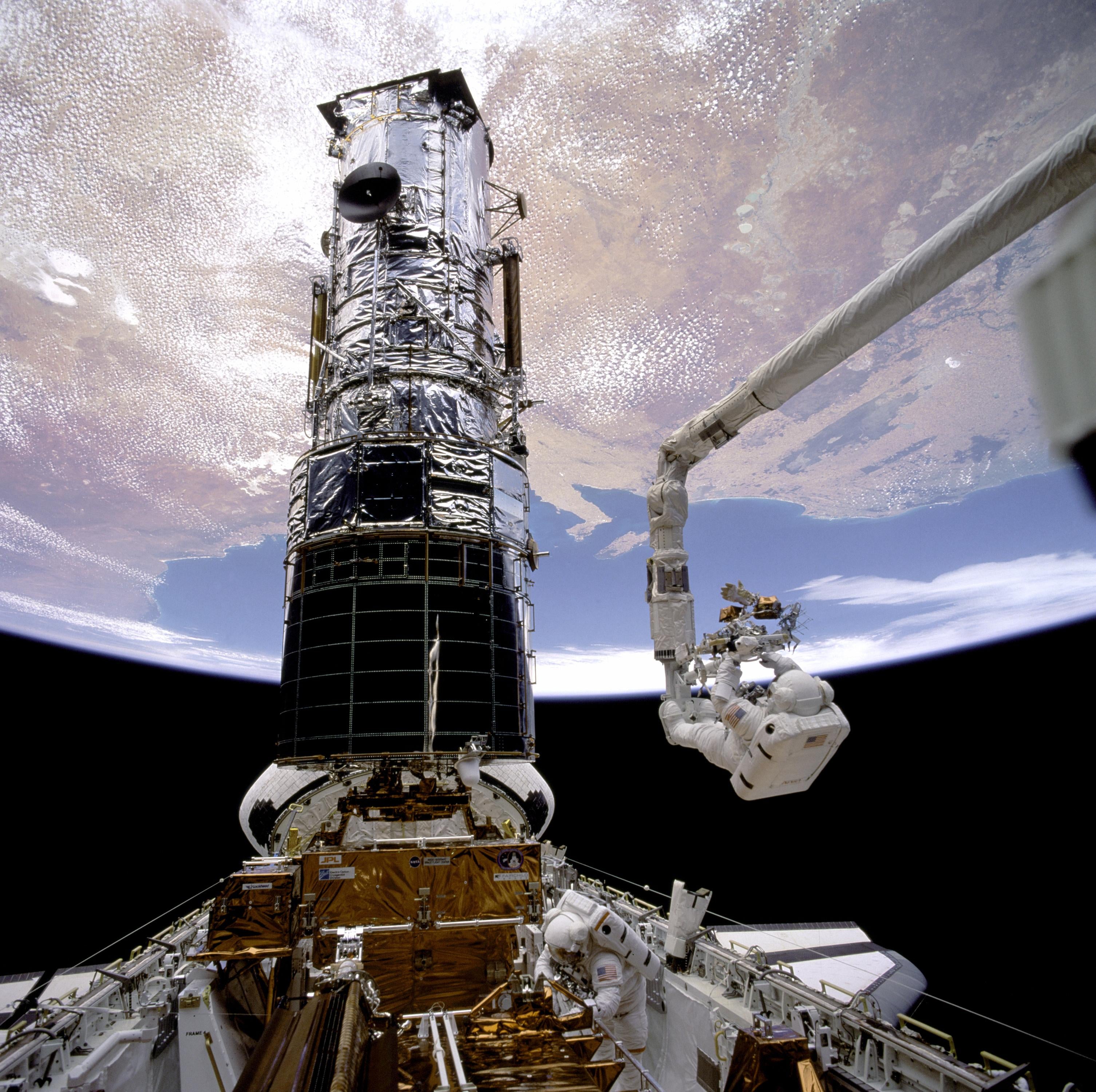 During  the first mission to service the Hubble Space Telescope in 1993,  astronauts installed a set of specialised lenses to correct a problem  that caused blurry images. 