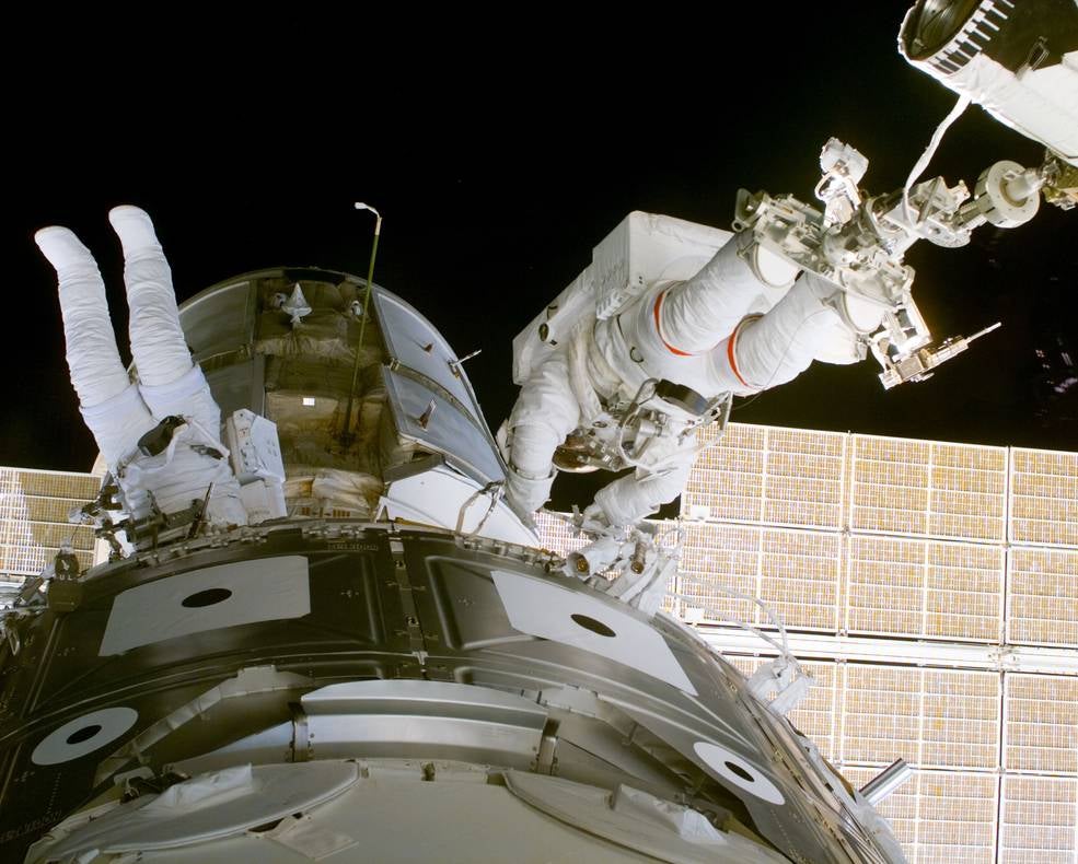 NASA astronauts Jerry Ross and James Newman performing the very first EVA at ISS in 1988. (Photo: NASA)