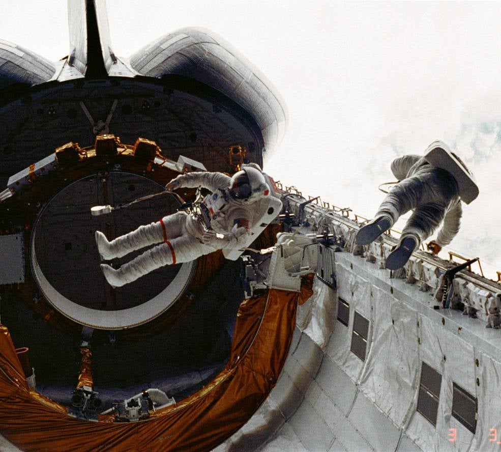 STS-6 astronauts F. Story Musgrave (left) and Donald H. Peterson during the first ShuttleEVA in 1983. (Photo: NASA)