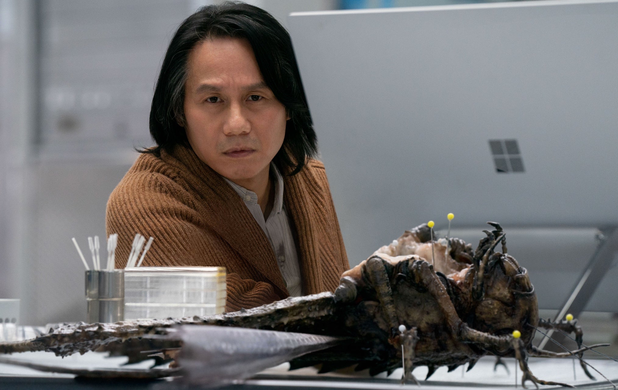 Dr. Wu and a locust. (Image: Universal)