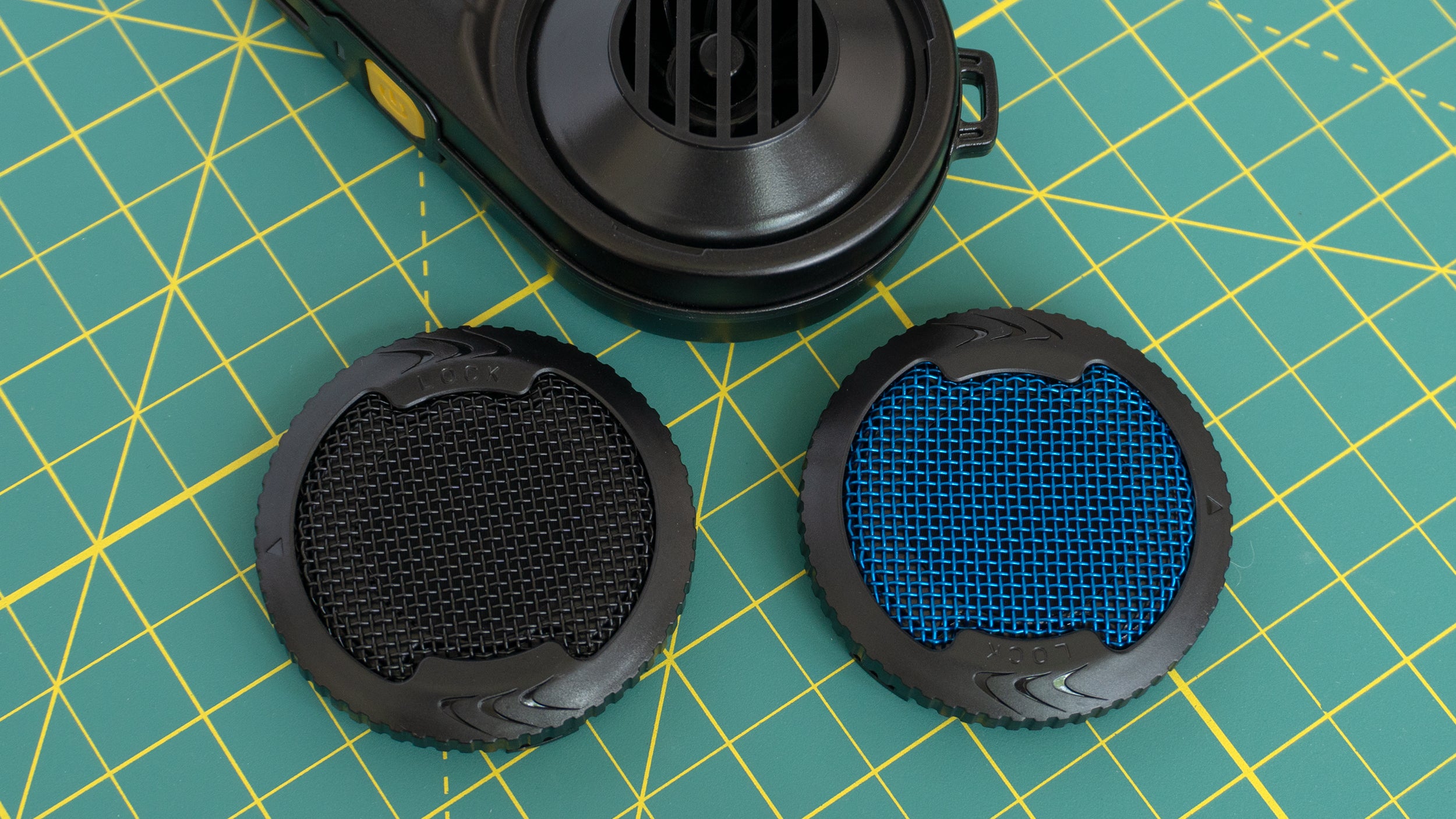 An alternate CMOS Air Filter (the blue version) can be swapped in to filter out even finer particles and reduce the power of the BlowerBaby so it can be safely used to clean camera sensors. (Image: Andrew Liszewski | Gizmodo)
