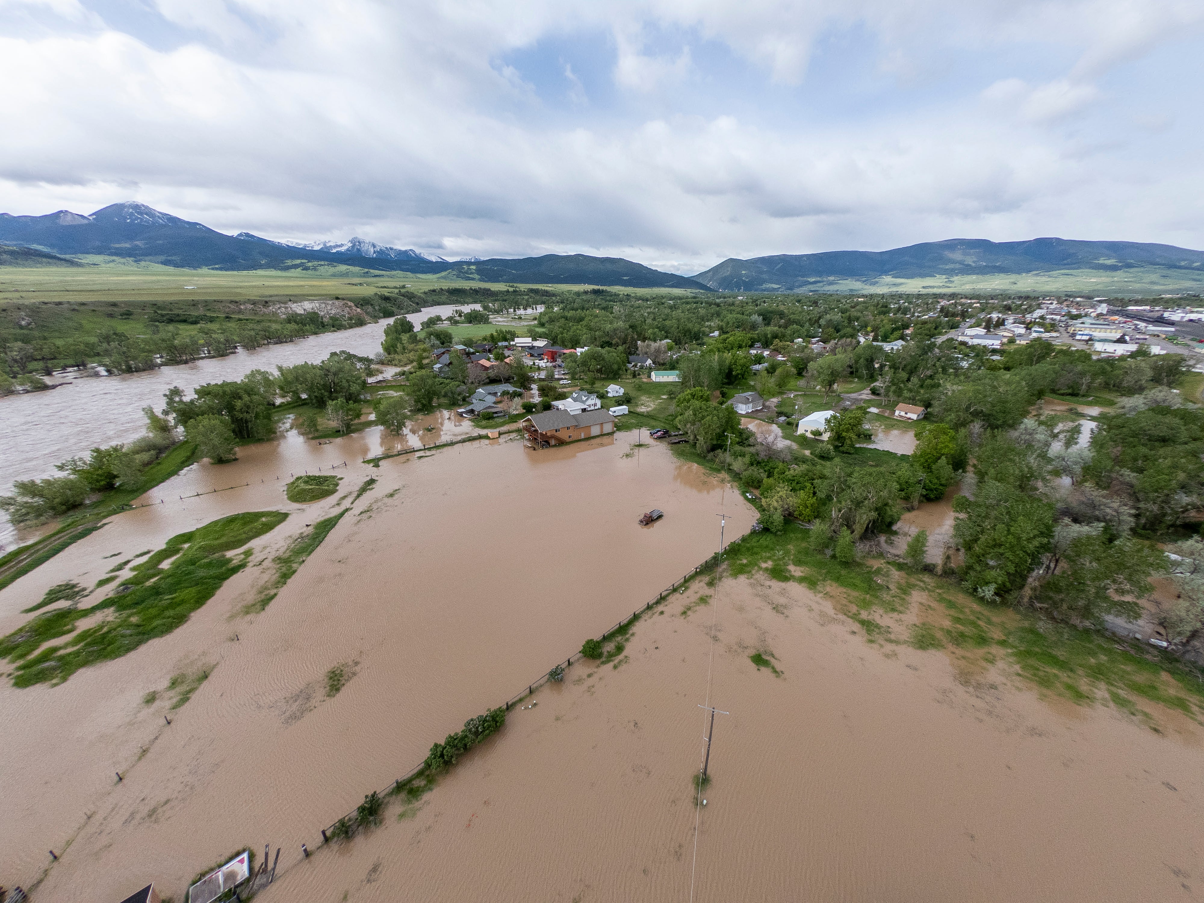In this aerial view, flooding is seen on June 14, 2022 in Livingston,  Montana. The Yellowstone River hit a historic high flow from rain  and snow melt from the mountains in and around Yellowstone National  Park.  (Photo: William Campbell, Getty Images)