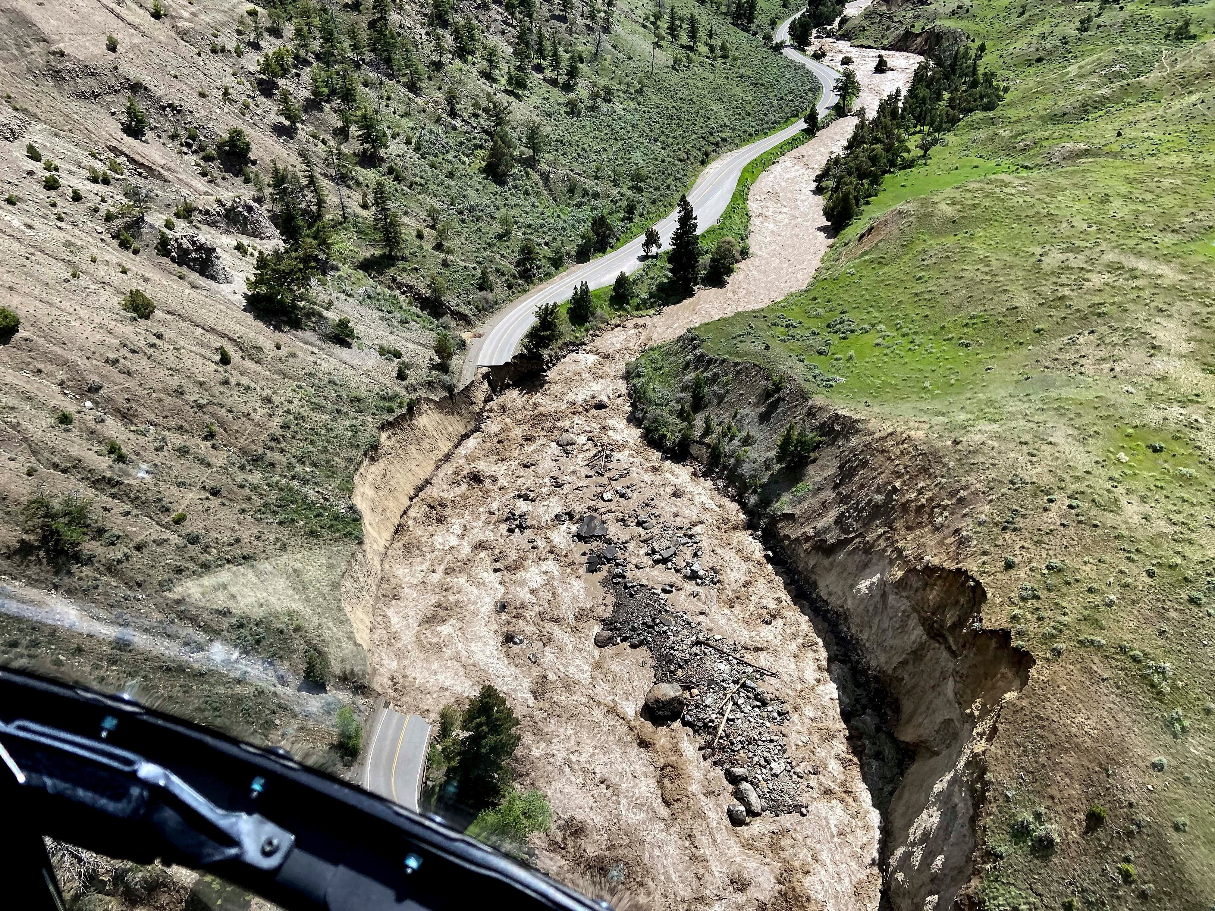 This aerial photo provided by the National Park Service shows a flooded  out North Entrance Road, of Yellowstone National Park in Gardiner,  Mont., on June 13, 2022. (Photo: Doug Kraus/National Park Service, AP)