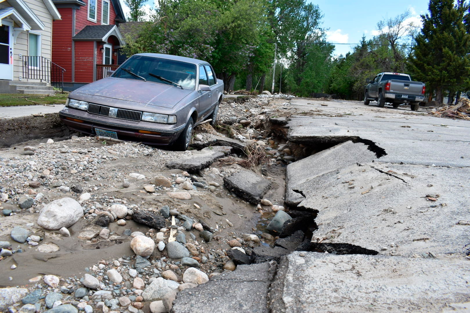Flood damage is seen along a street Tuesday, June 14, 2022, in Red Lodge, Mont. (Photo: Matthew Brown, AP)