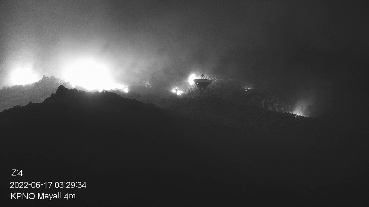 Part of the Contreras Fire burning on the slopes of the Kitt Peak mountain on early morning June 17. In the foreground NRAO's Very Long Baseline Array Dish is seen. (Image: KPNO/NOIRLab/NSF/AURA)
