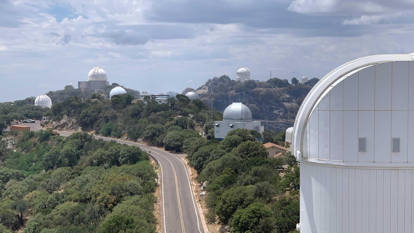 In this image taken June 18, Kitt Peak's telescopes appear to have been spared the worst of the wildfire. (Image: KPNO/NOIRLab/NSF/AURA)