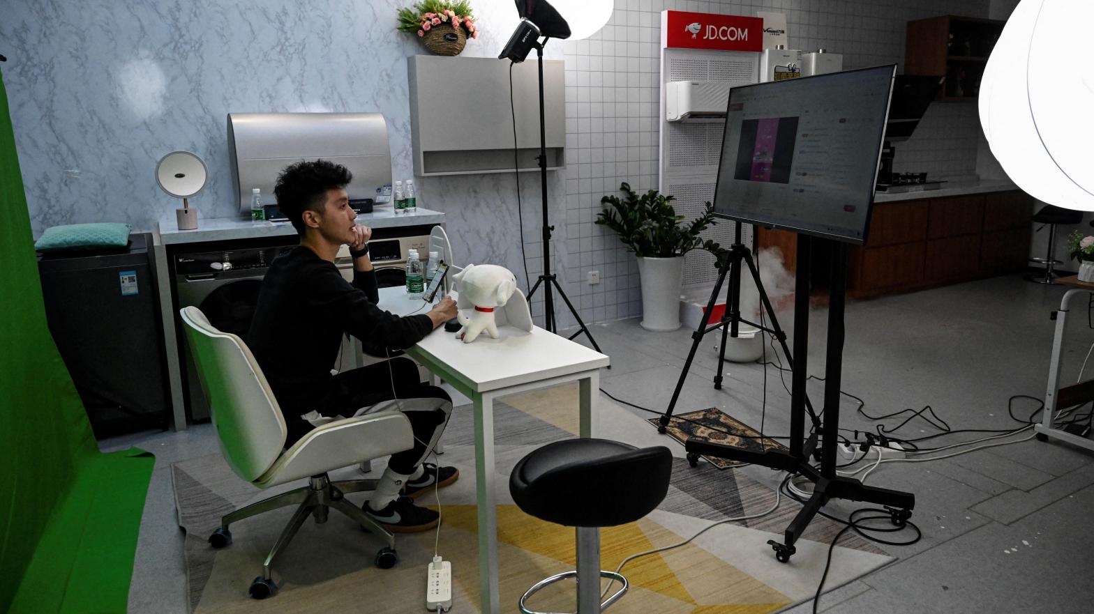 A livestreamer sells products at a JD outsourcing livestream company in Beijing, China on November 9, 2021. (Photo: Jade Gao / AFP, Getty Images)