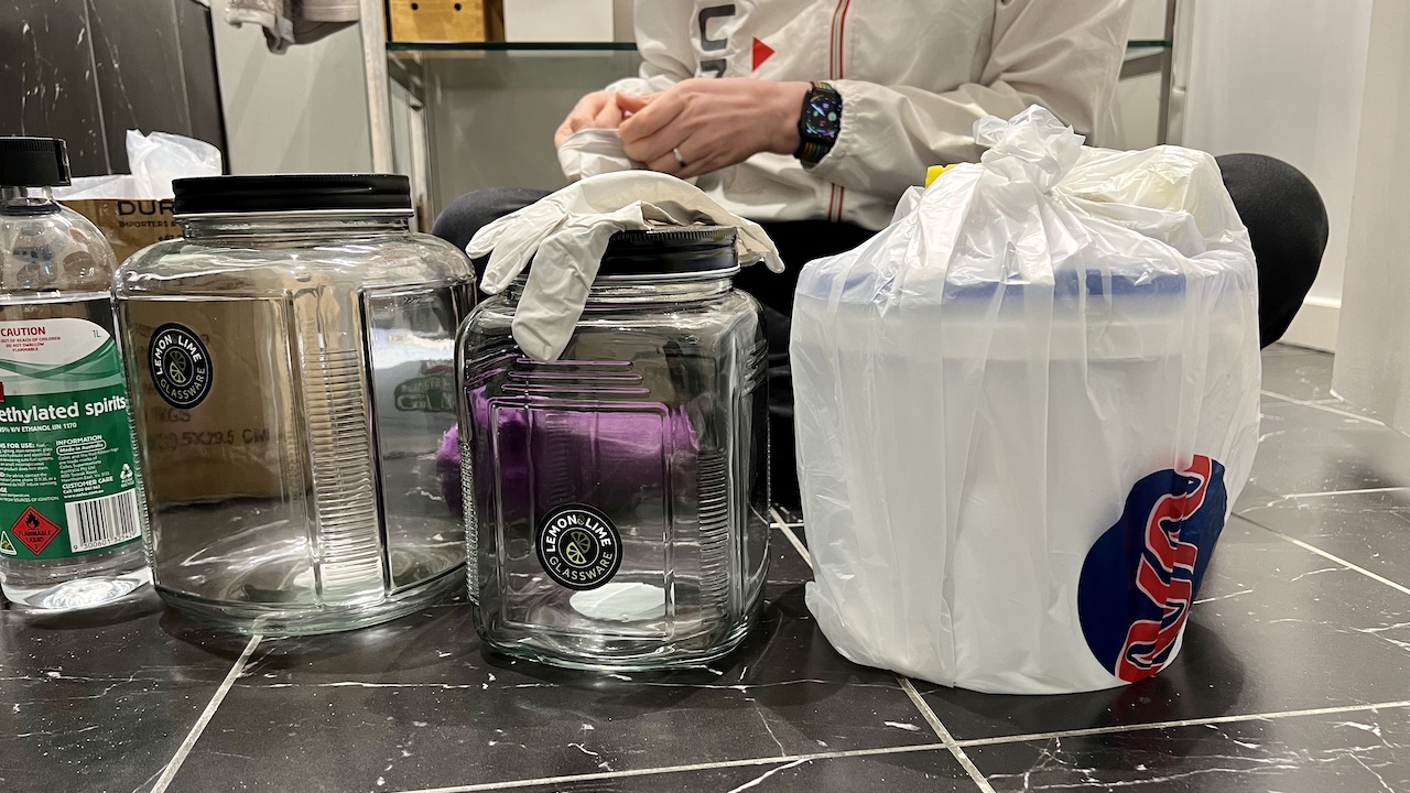 Preserving a human organ: A bucket, jars and bottles of methylated spirits