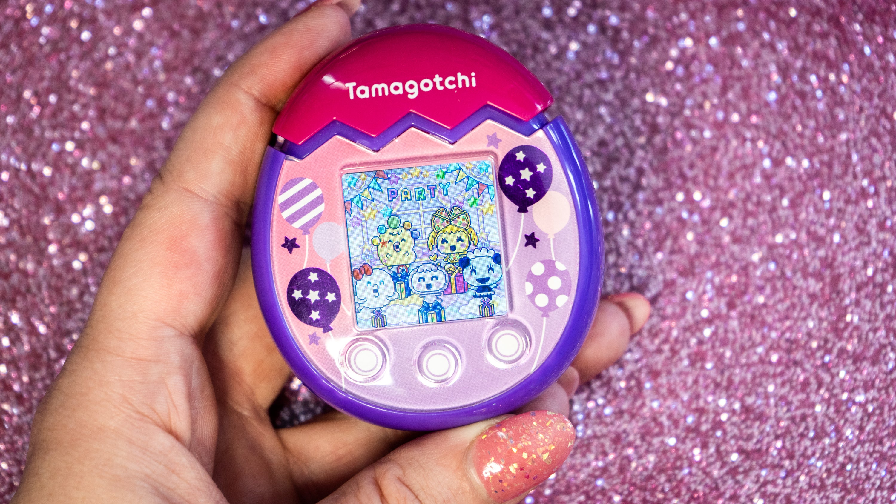Look at these happy Tamagotchi. How could you deny throwing them a party?  (Photo: Florence Ion / Gizmodo)