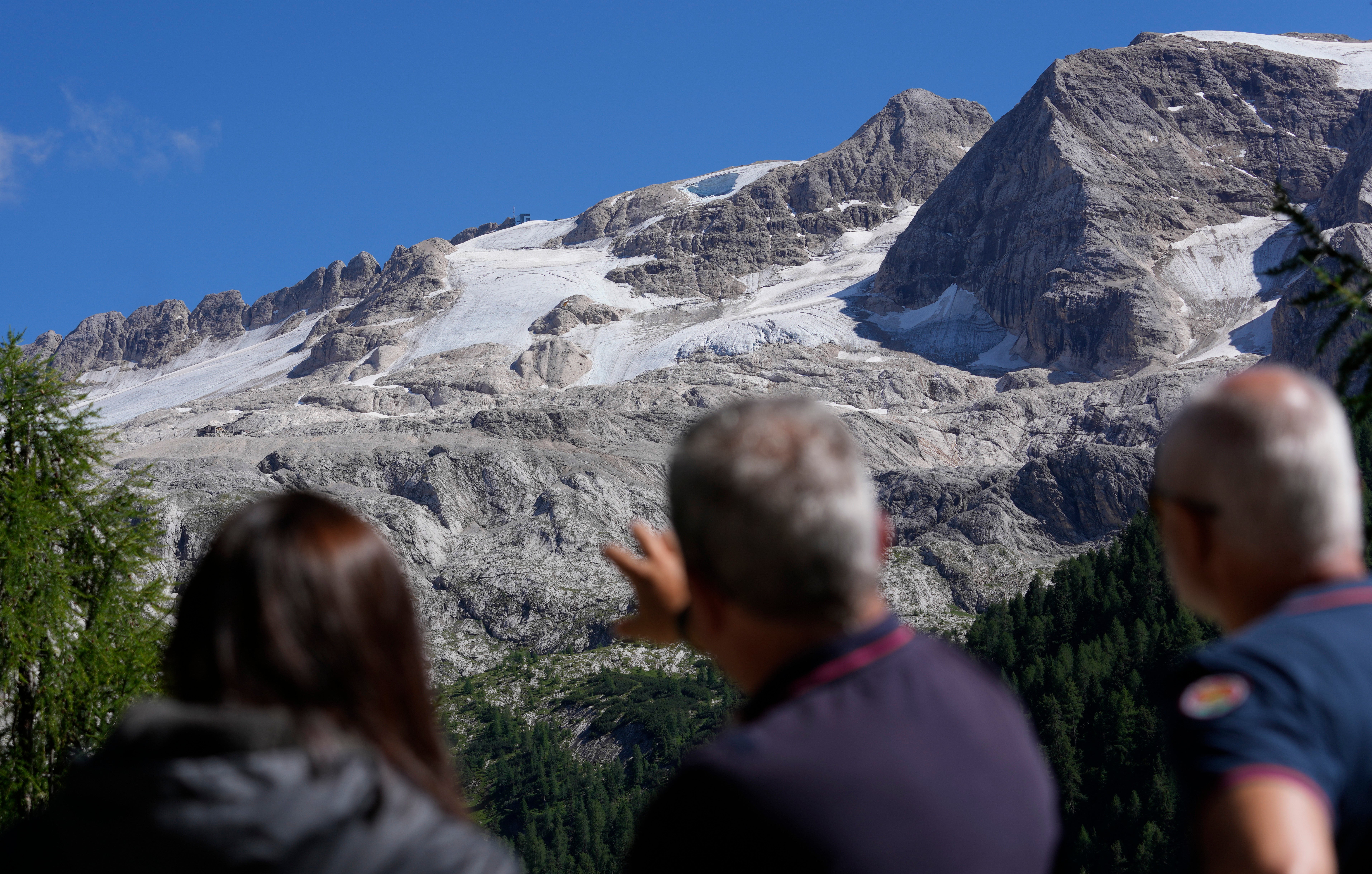 People look at the glacier on Marmolada on July 4. (Photo: Luca Bruno, AP)