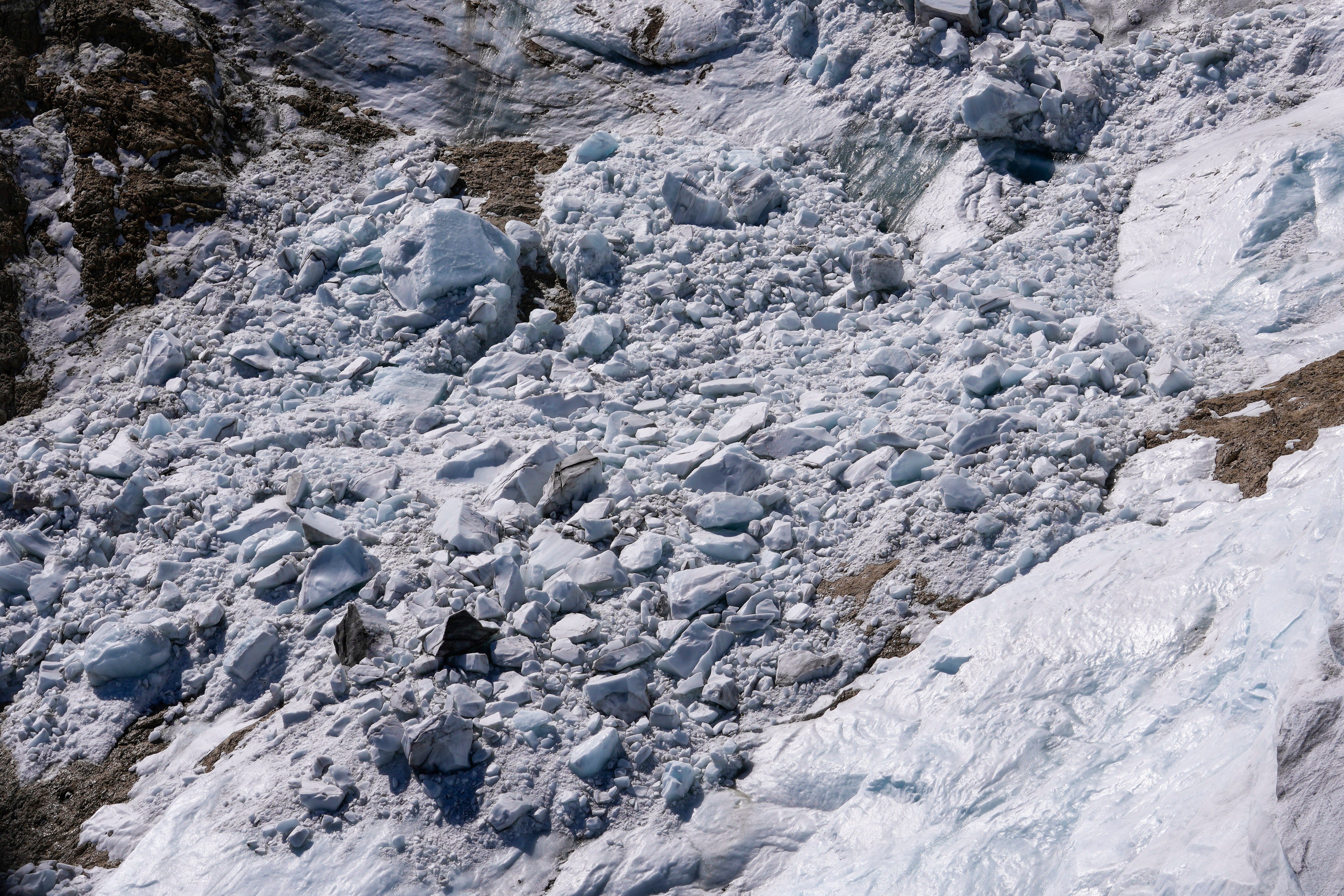 Debris and chunks of ice from the avalanche. (Photo: Luca Bruno, AP)