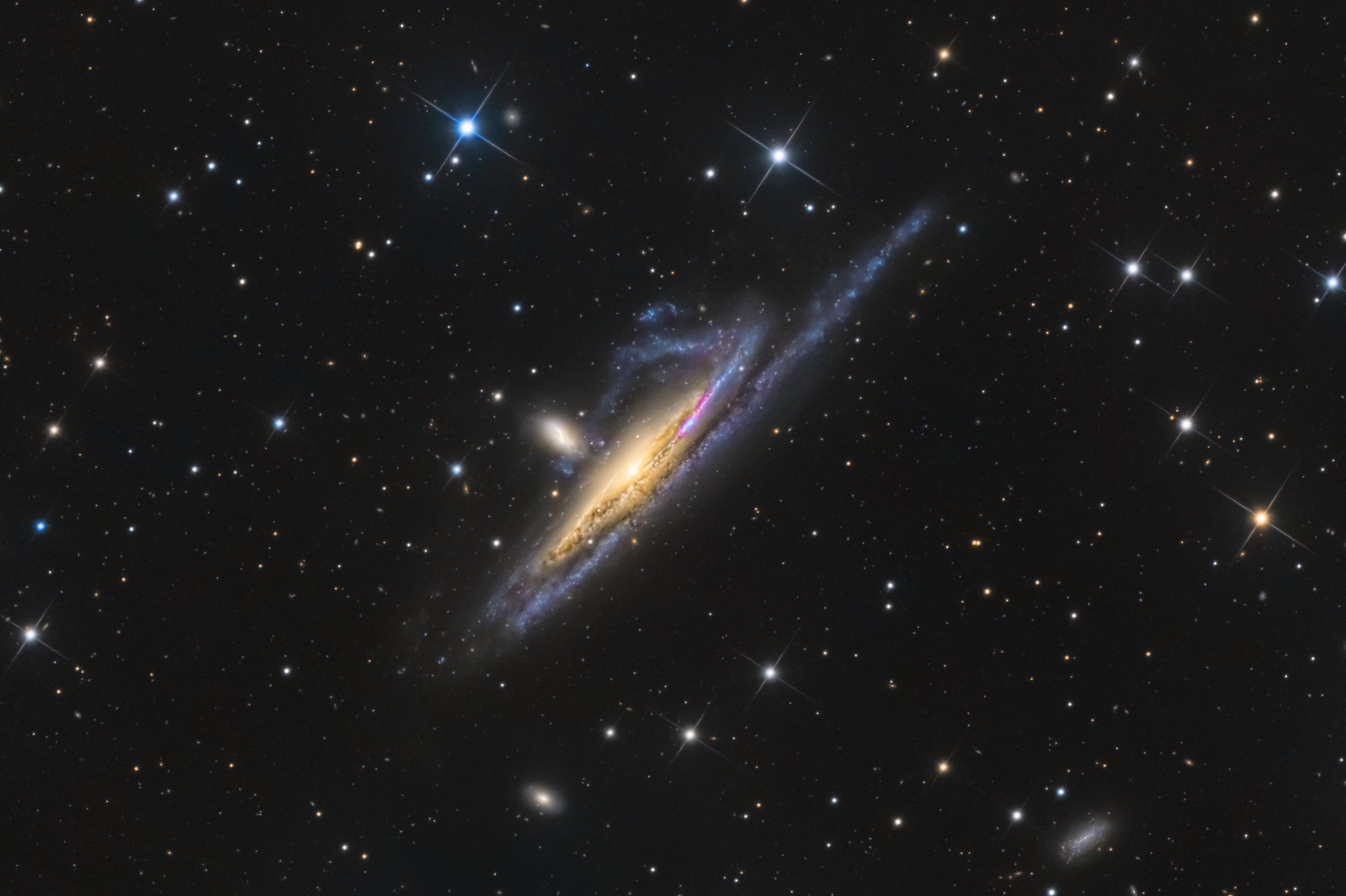 Two galaxies encroach on one another. (Photo: © Terry Robison)