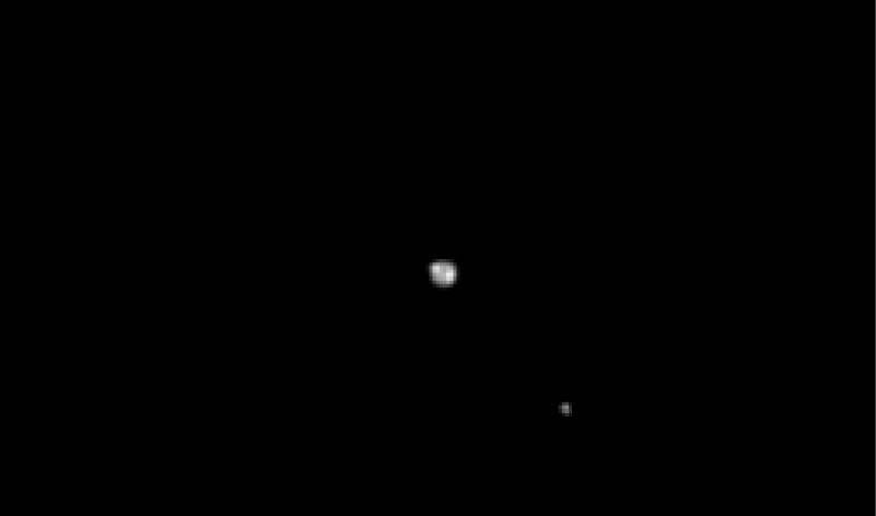 Pluto and Charon when New Horizons was 69 million miles (111 million kilometers) away. (Image: NASA/JHU-APL/SwRI)