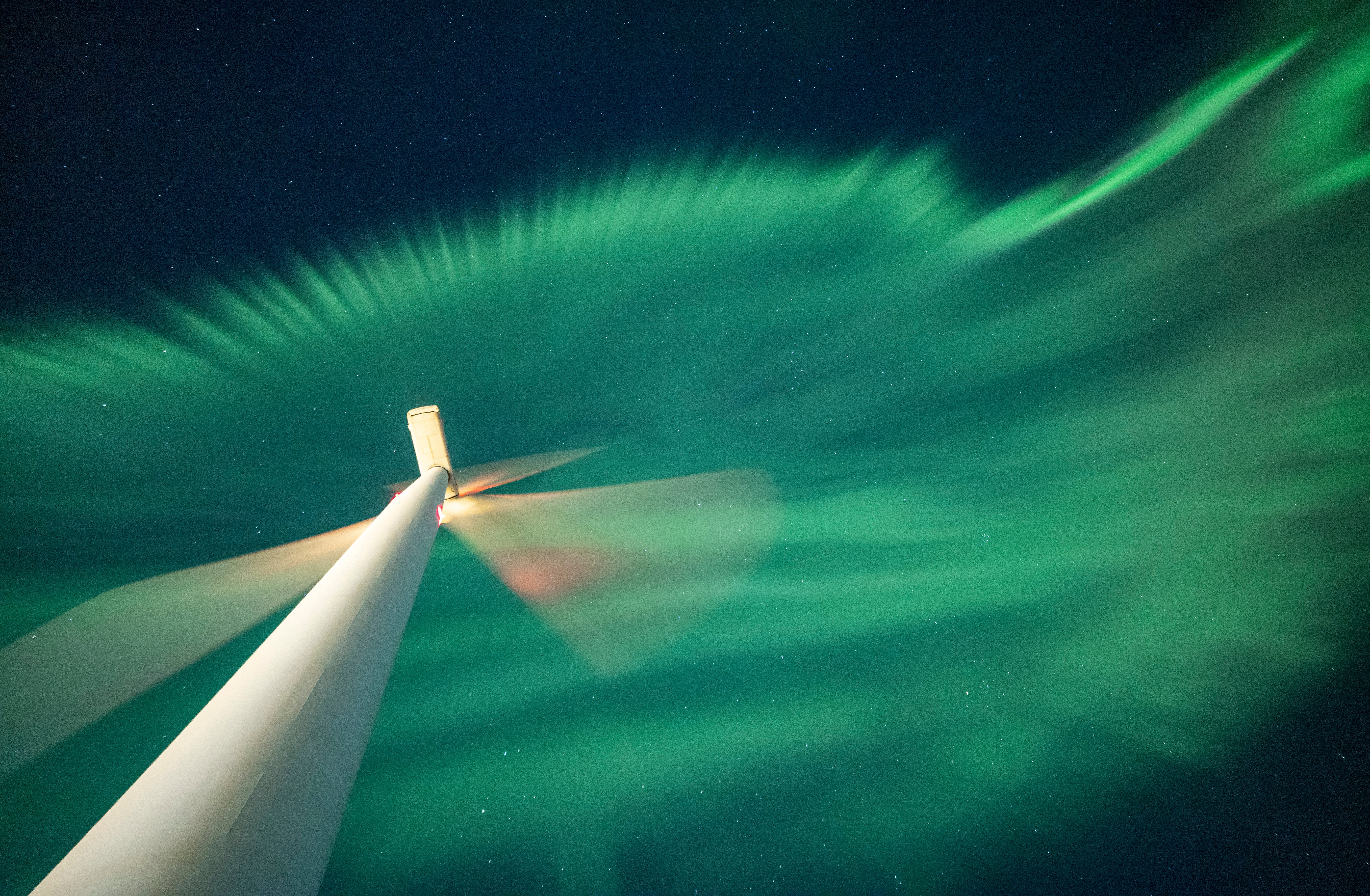 The aurora seen over a wind turbine in Finland. (Photo: © Esa Pekka Isomursu)