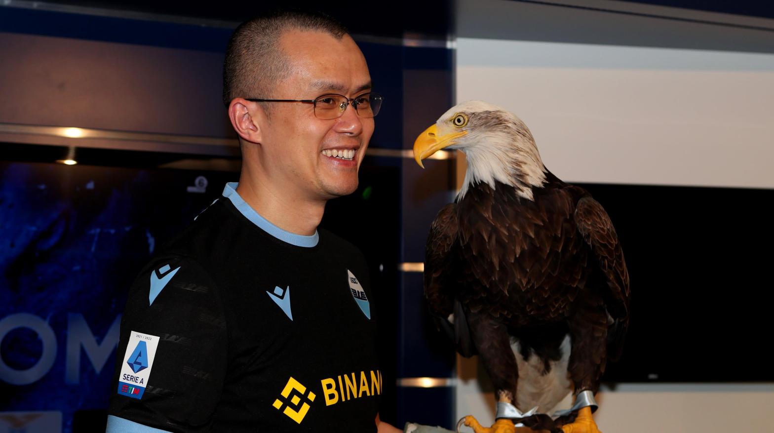 Binance CEO Changpeng Zhao poses with SS Lazio eagle mascotte Olimpia during the visit at Formello Sport centre in Rome, Italy.  (Photo: Paolo Bruno, Getty Images)