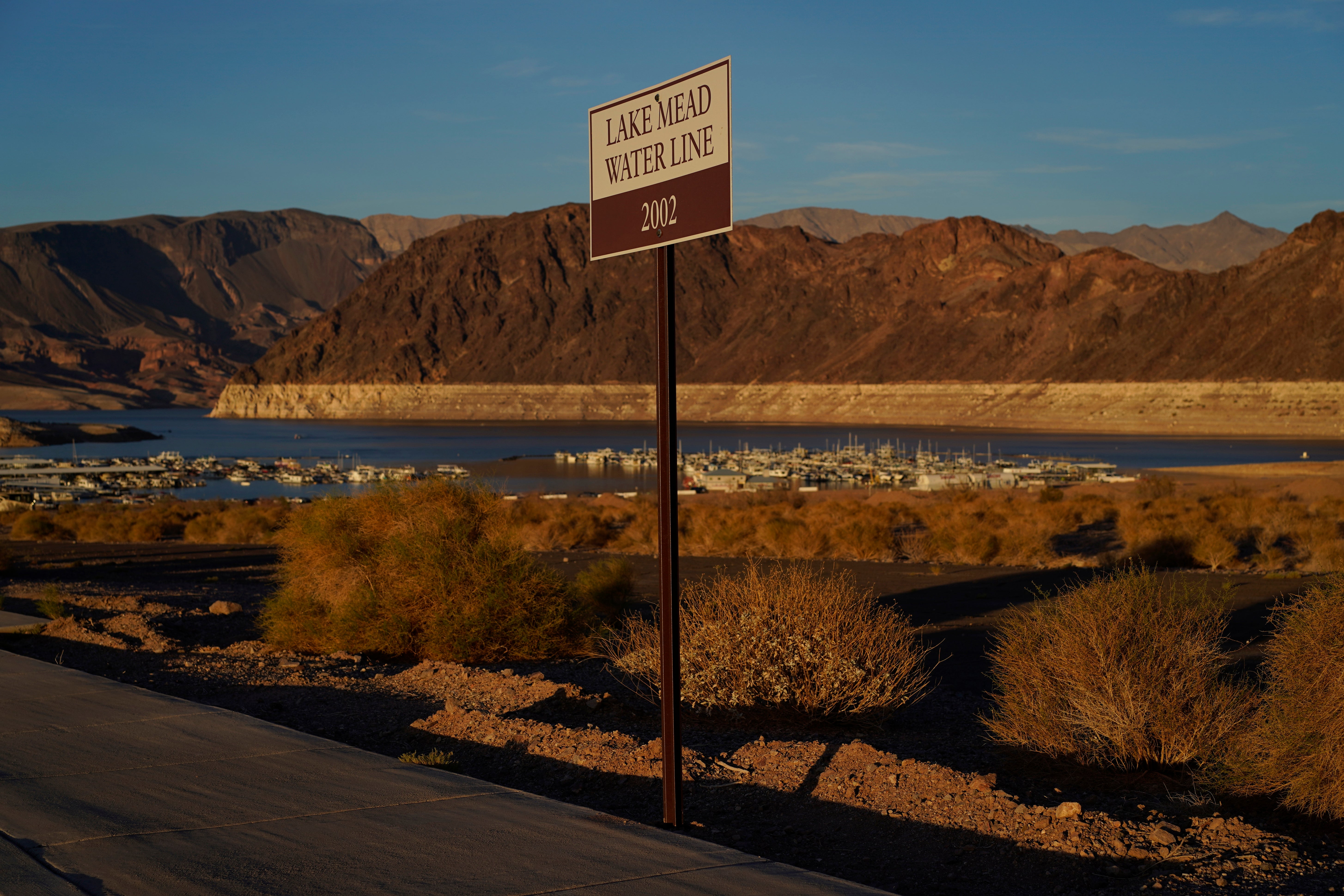 A sign at Lake Mead marks where the water line was in 2002. (Photo: John Locher, AP)