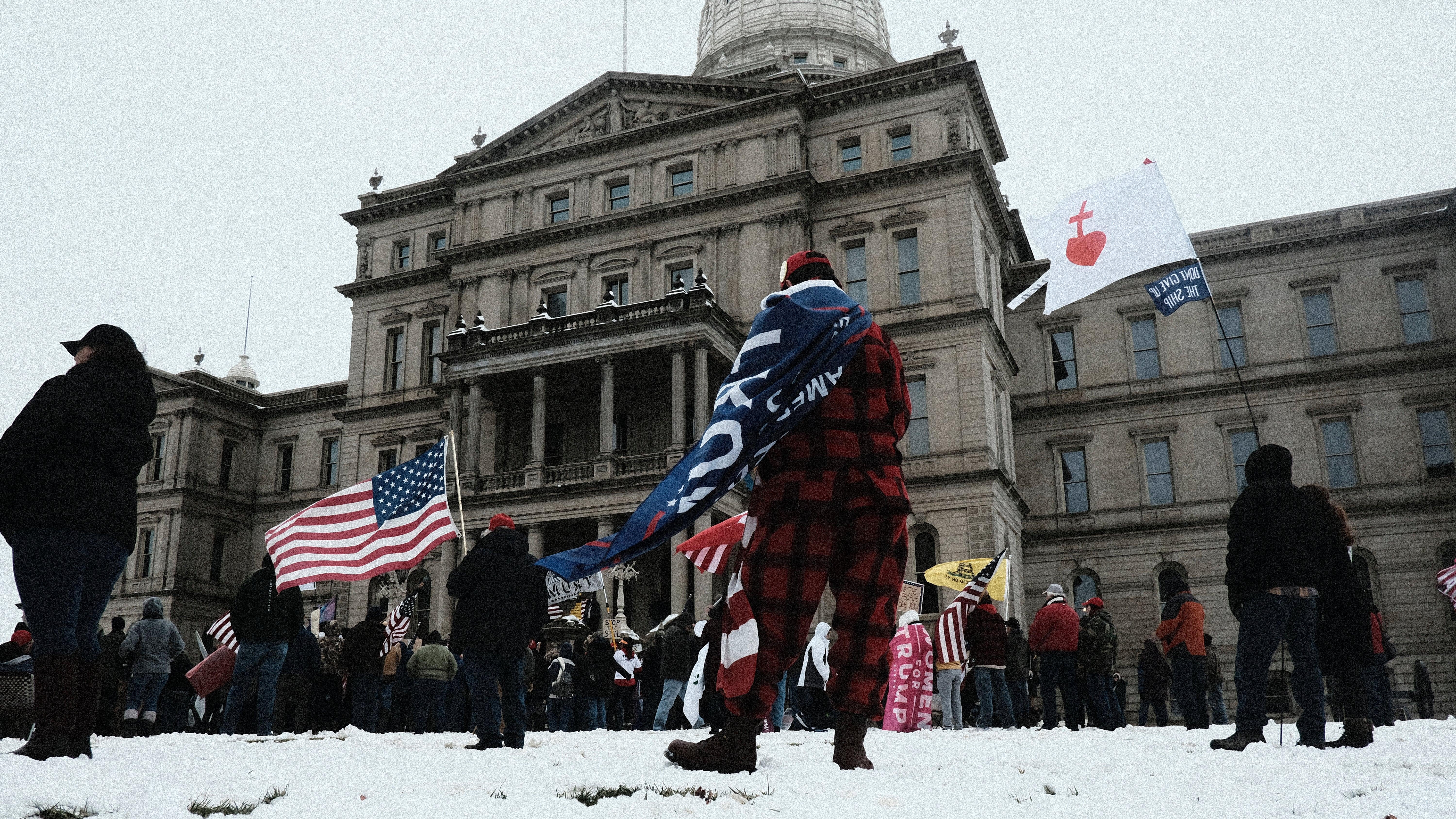  Donald Trump supporters gather around the Michigan State Capitol Building to protest the certification of Joe Biden as the next president of the United States on January 6, 2021 in Lansing, Michigan (Photo: Matthew Hatcher, Getty Images)