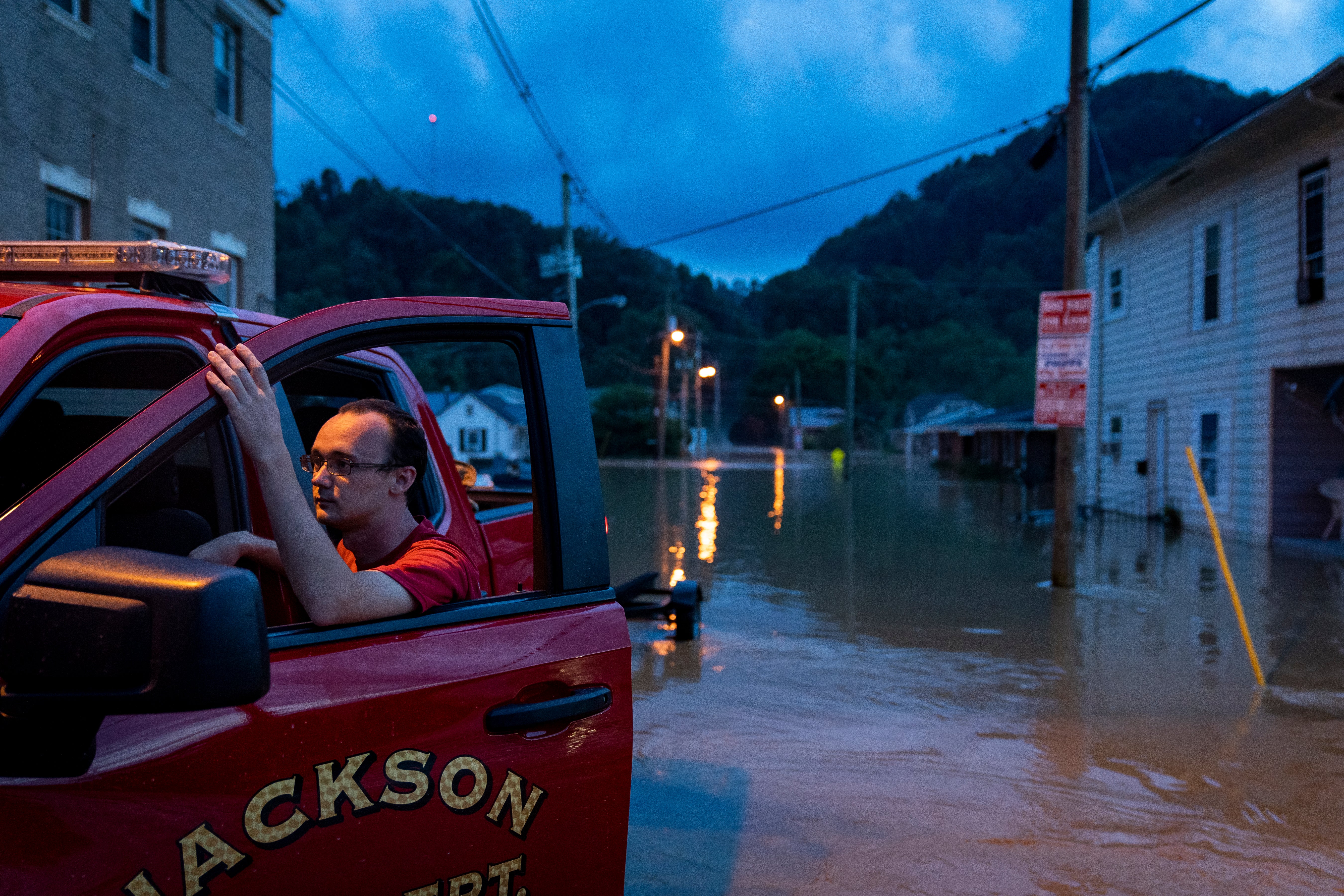 A firefighter with the Jackson Fire Department in front of the flooding in Jackson, Kentucky.  (Photo: Michael Swensen, Getty Images)