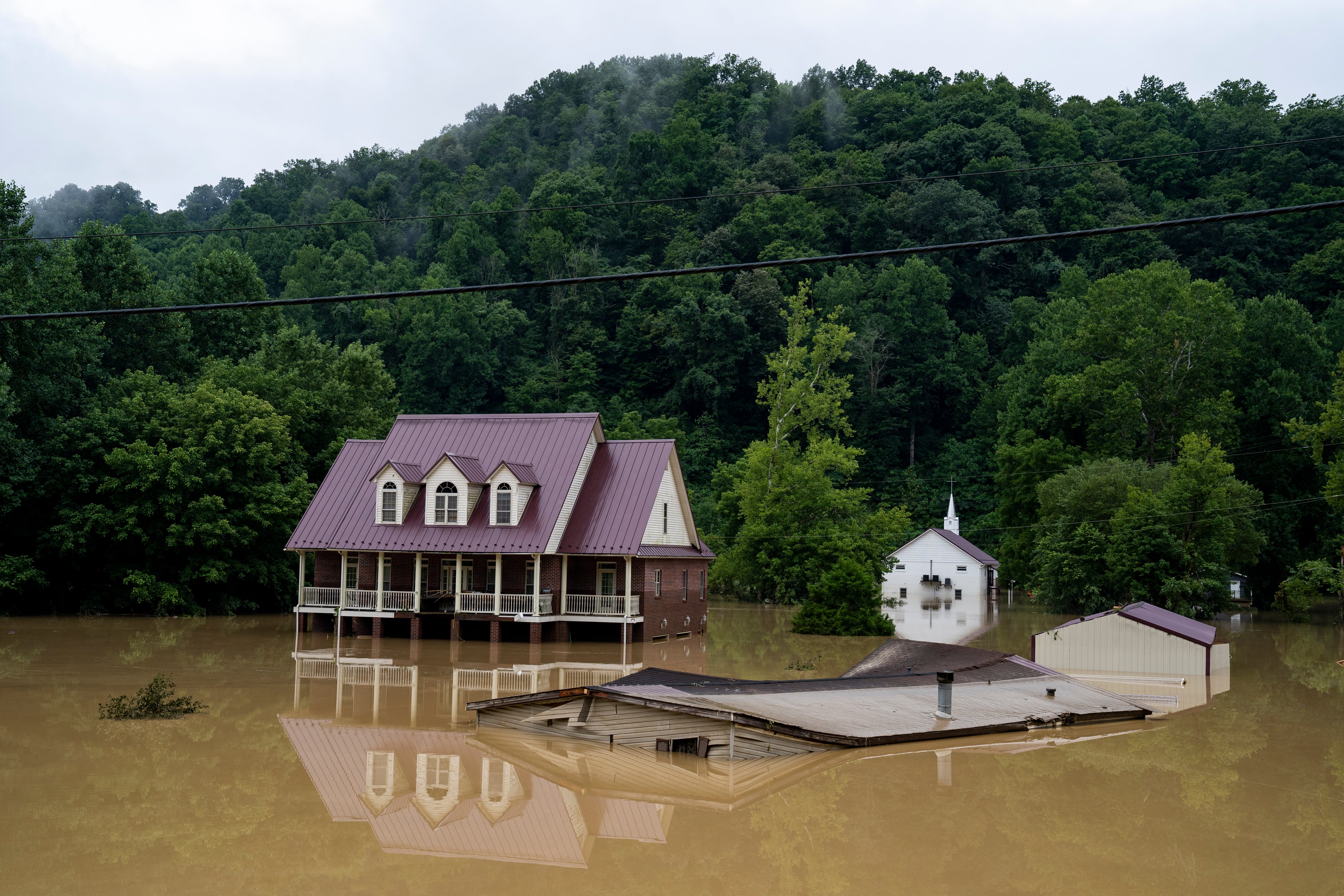 A house is seen almost completely submerged off of the Bert T Combs  Mountain Parkway on July 29, 2022 in Breathitt County, Kentucky.  (Photo: Michael Swensen, Getty Images)