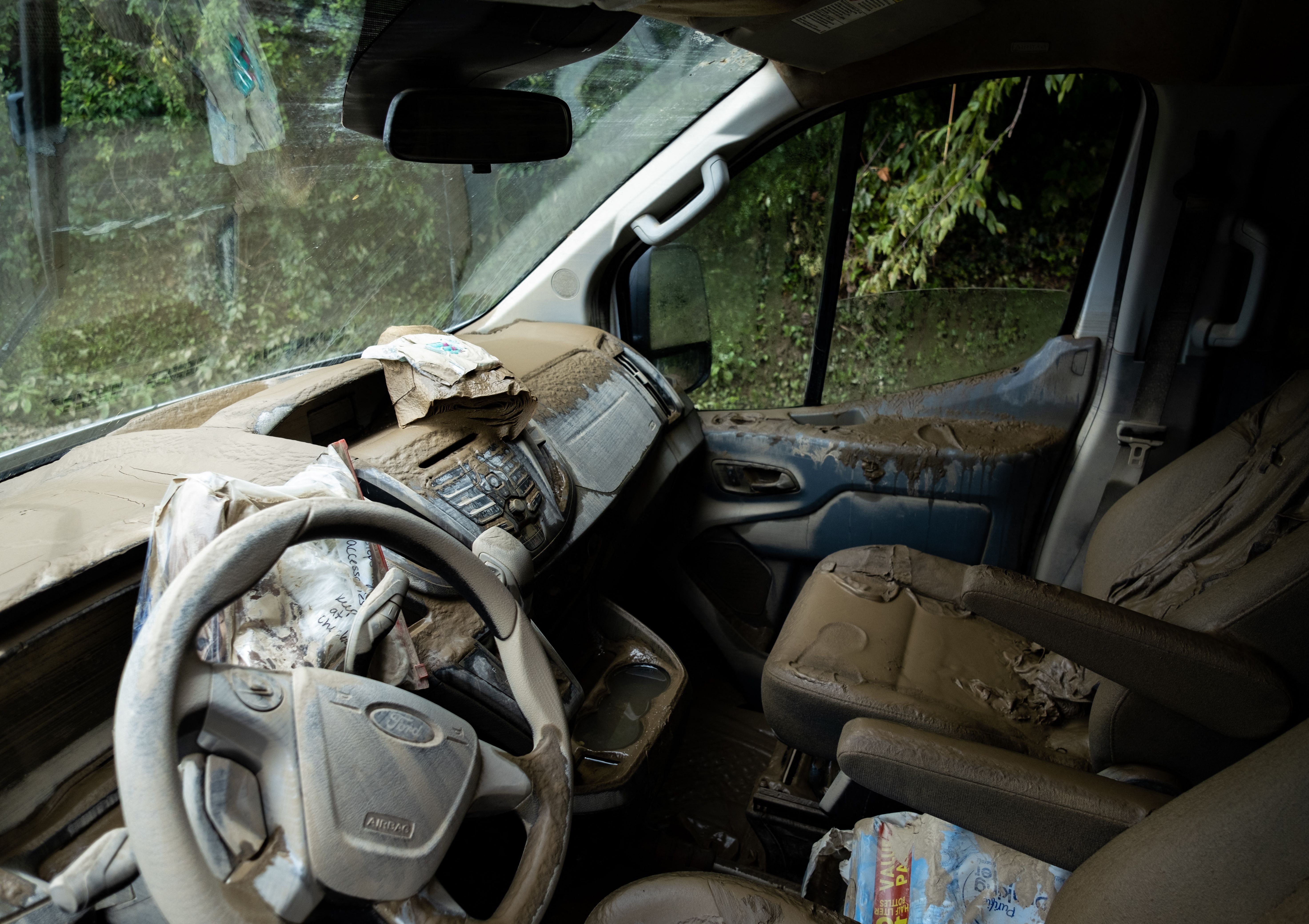 Mud is seen inside a water-damaged car in the aftermath of historic  flooding in Eastern Kentucky near Jackson, Kentucky on July 31, 2022. (Photo: Seth Herald / AFP, Getty Images)