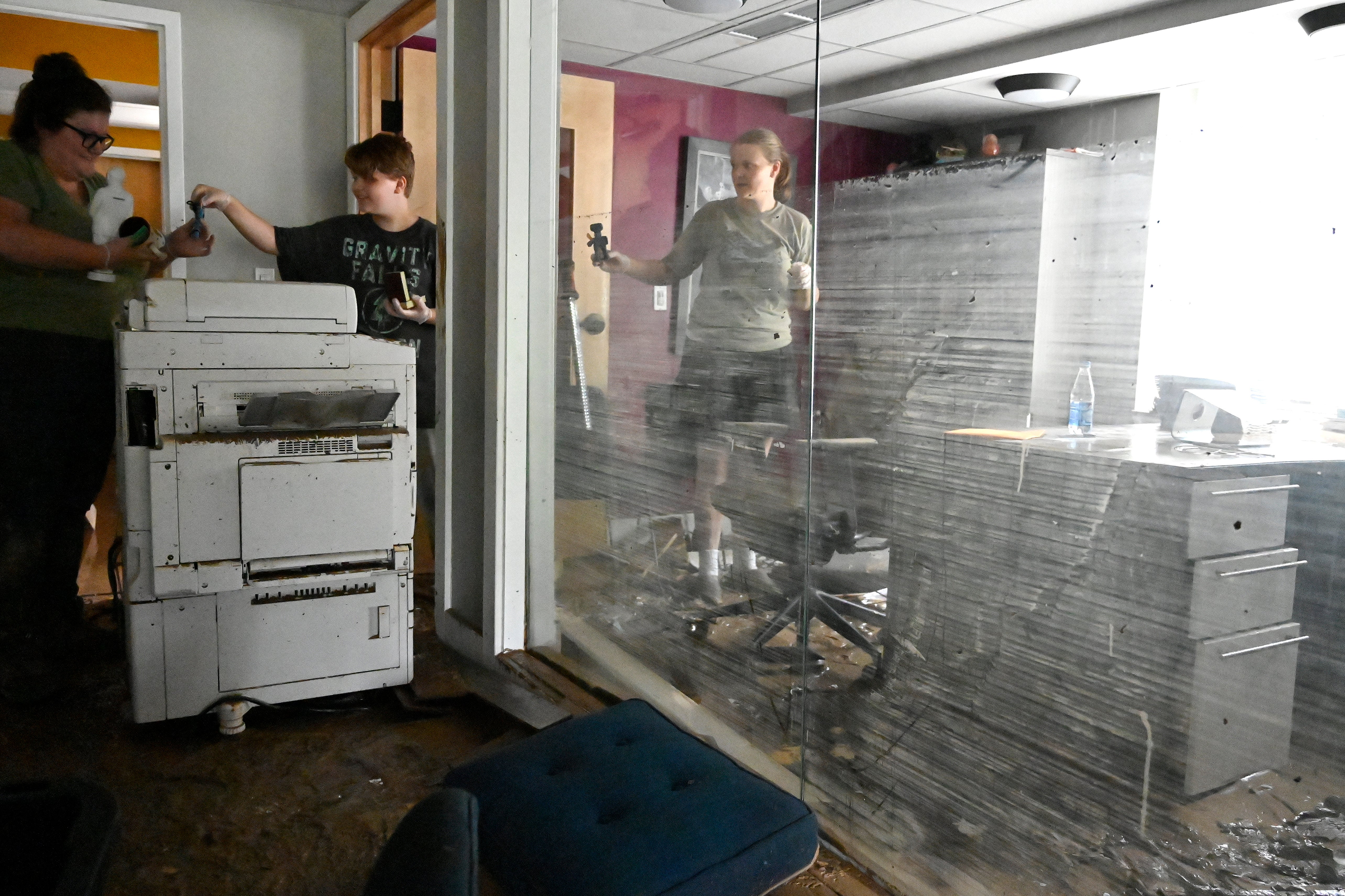 Employees of the Hindman Settlement School clean out the offices of the  school following flooding in Hindman, Ky., Friday, July 29, 2022. (Photo: Timothy D. Easley, AP)