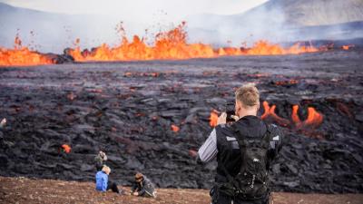 Snap-Happy Tourists Are Walking up to Lava Near the Reykjavik Airport for Pics