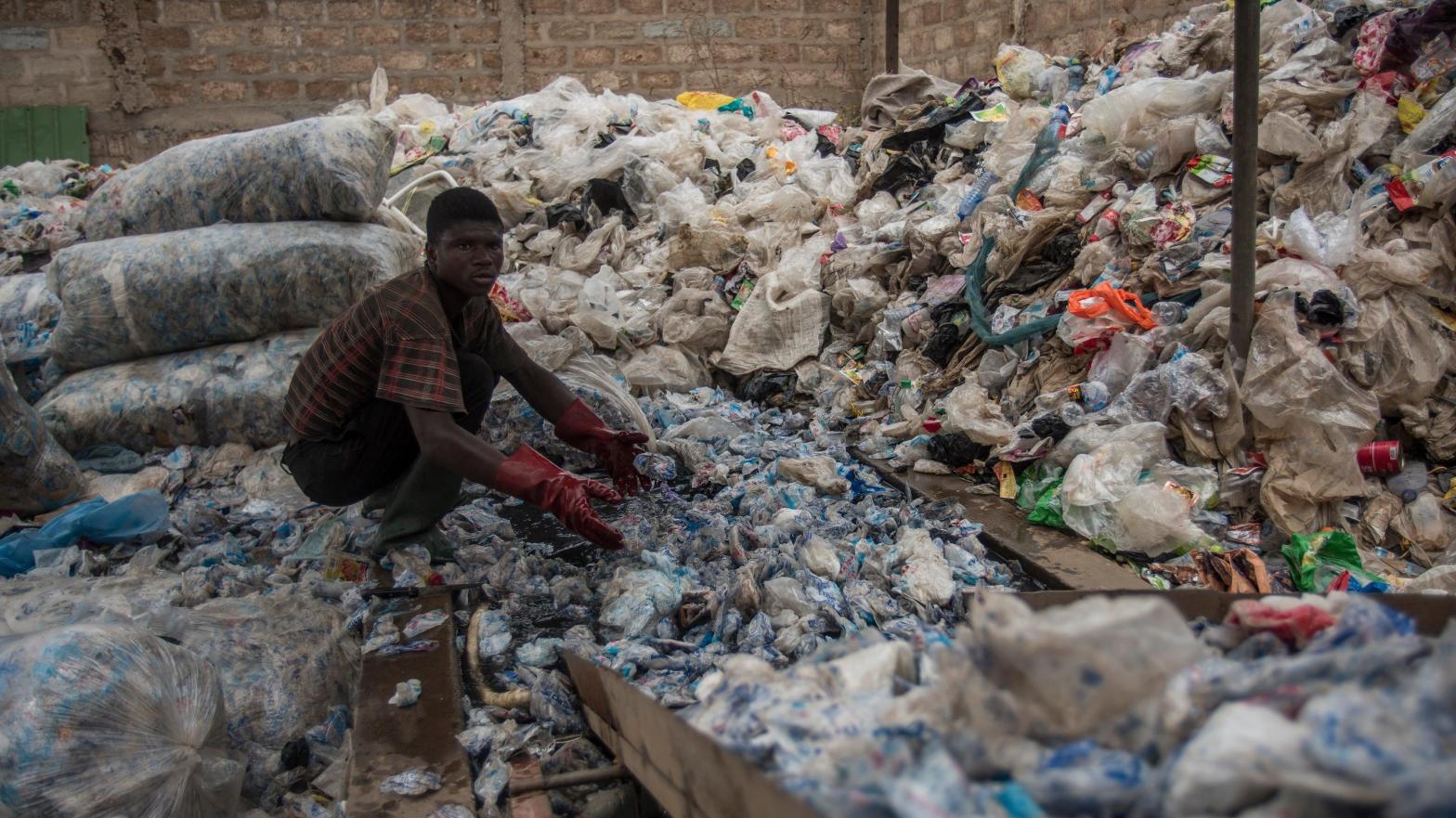 A worker in Accra sorts plastic for recycling. (Photo: Cristina Aldehuela/AFP, Getty Images)
