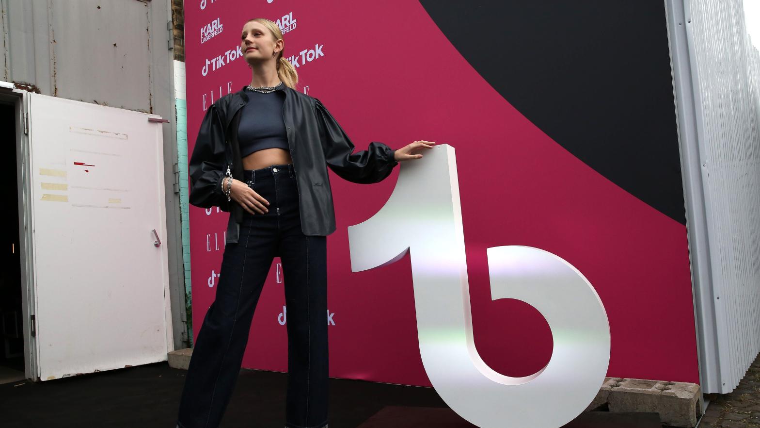 Fashion model Trixi Giese poses with the logo of TikTok at a recent fashion show in Germany. The social media company has come under fire for the data it supposedly collects on its users. (Photo: Adam Berry, Getty Images)