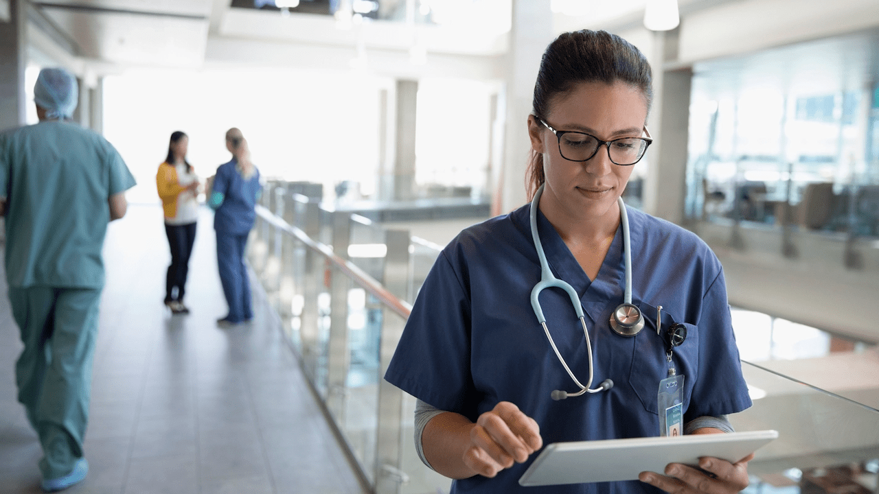 csiro alert tool: nurse holding ipad in a hospital